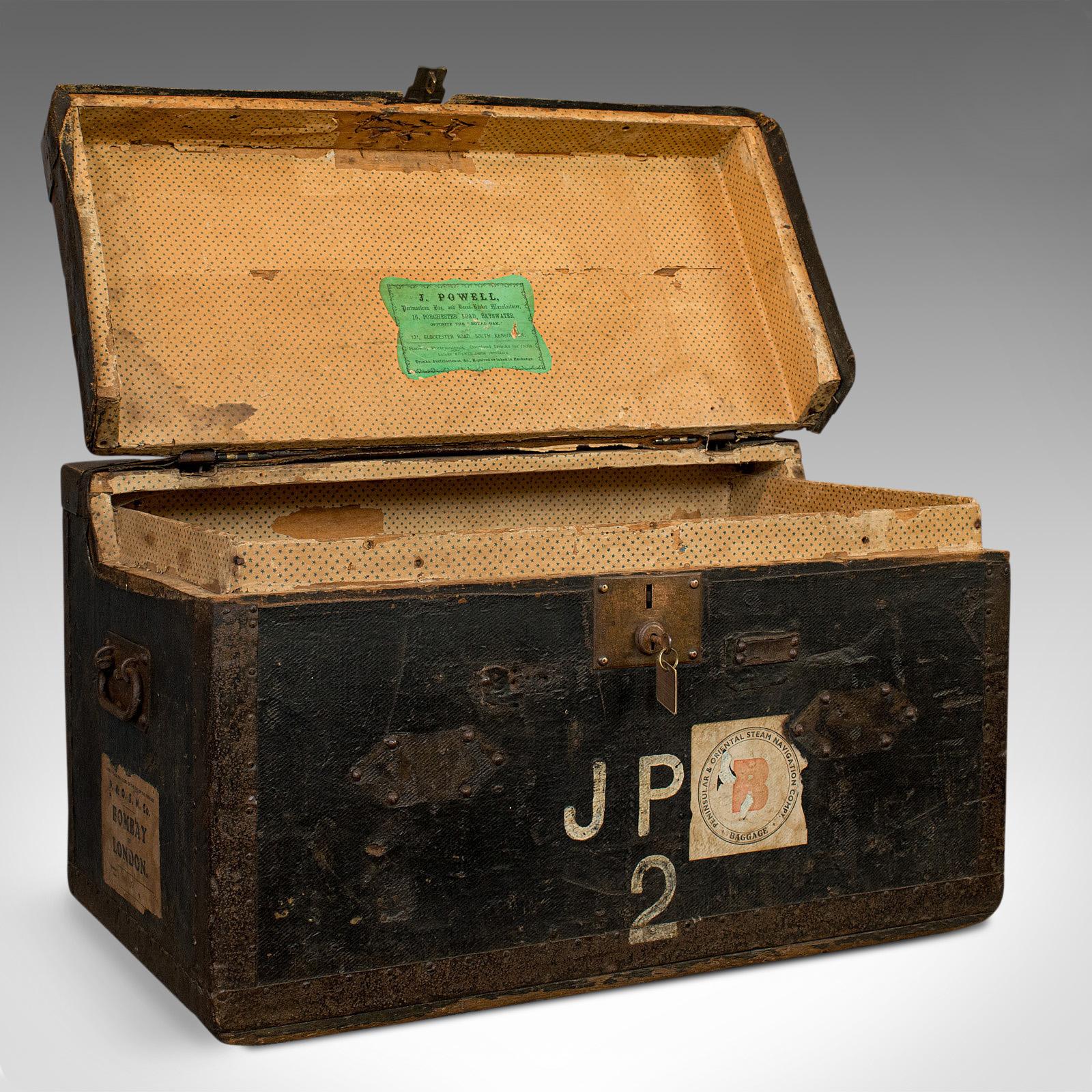 This is an antique explorer's portmanteau. An English, canvas travel trunk or coat chest dating to the early Victorian period, circa 1850.

A superb, fascinating early Victorian piece
Displays a desirable aged patina
Quality canvas finish in