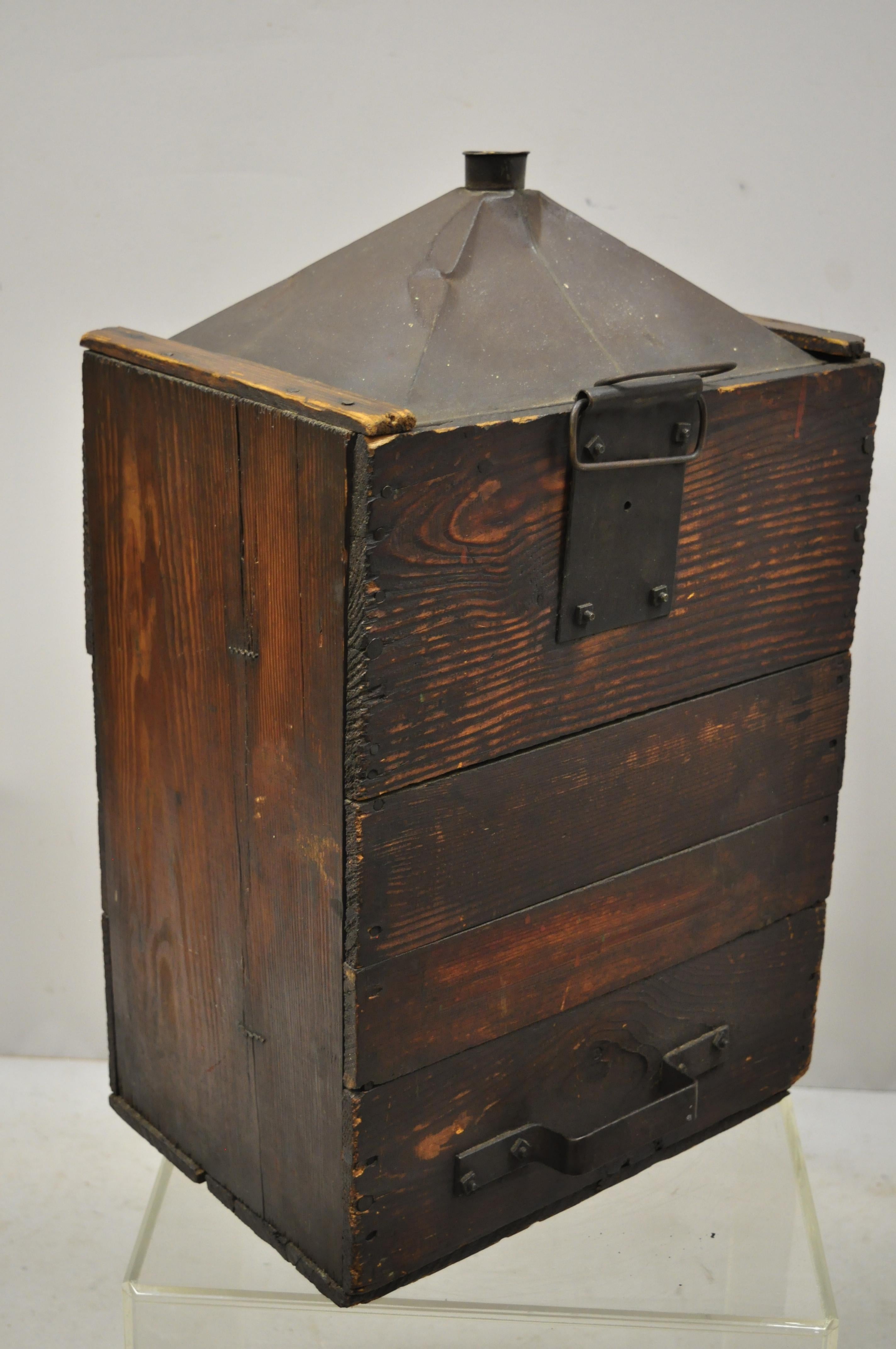 Antique export tin metal transport canister container with wood case. Item features a solid wood frame, galvanized tin metal container, remnants of cork to mouth of canister, very nice antique item. Believed to be a 5 gallon container and believed