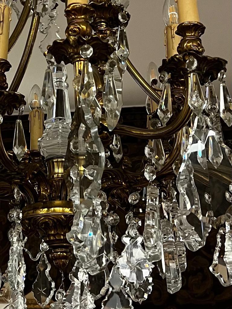 Very fine and exquisite gilt bronze crystal chandalier with 20 lights , beautiful large edged crystals up to 15cm high and 2,5 cm thick. Parameters are 110 cm hight and 85 cm diameter.  This solid gilt bronze chandlaier is very heavy and weighs