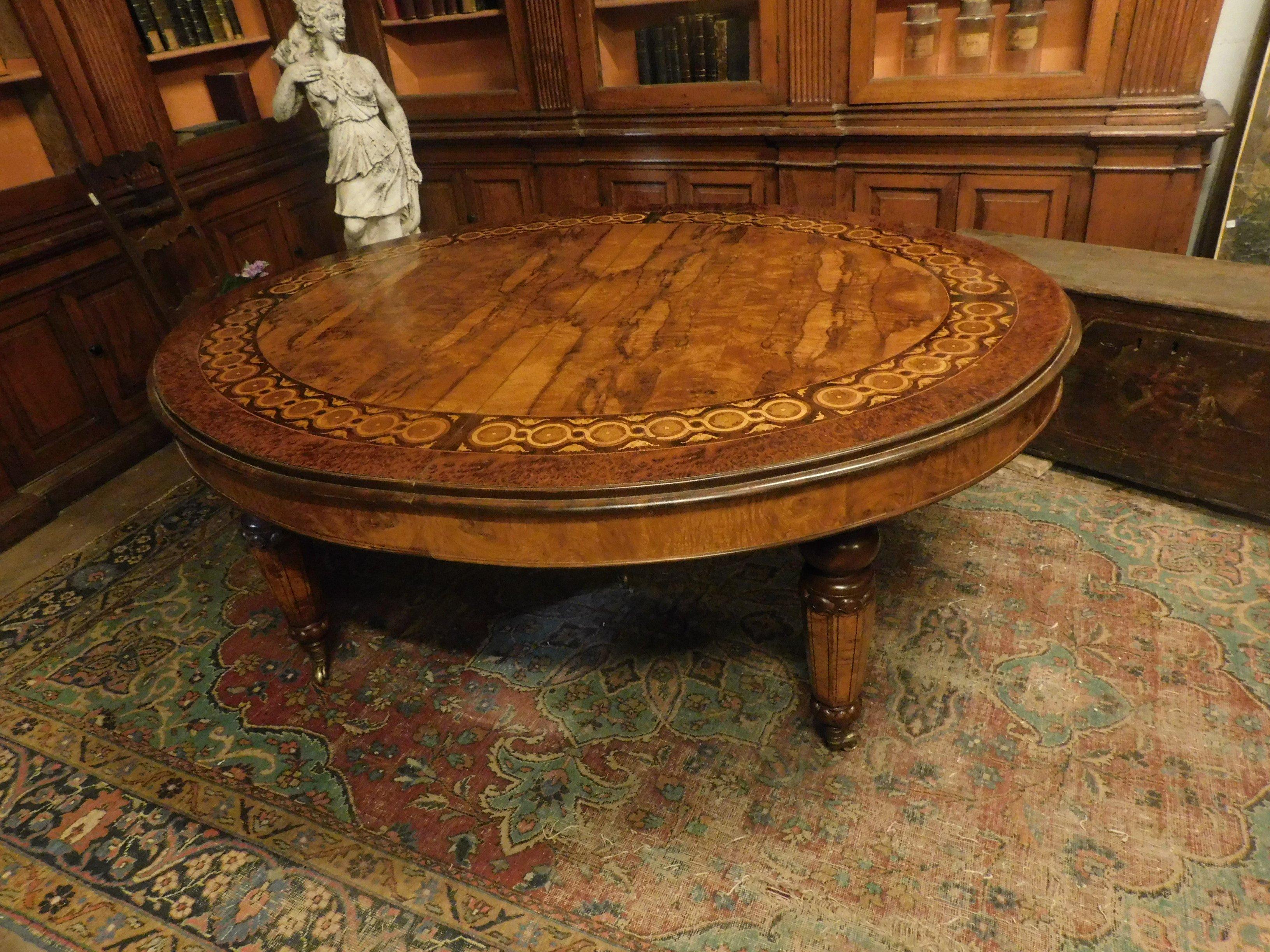 Antique table inlaid in mixed woods including dark and light brown walnut, briar, wick finish, hand polished with precious inlays of nature. Extendable dining table, has 4 extensions all also inlaid, very nice even without a tablecloth, it has a