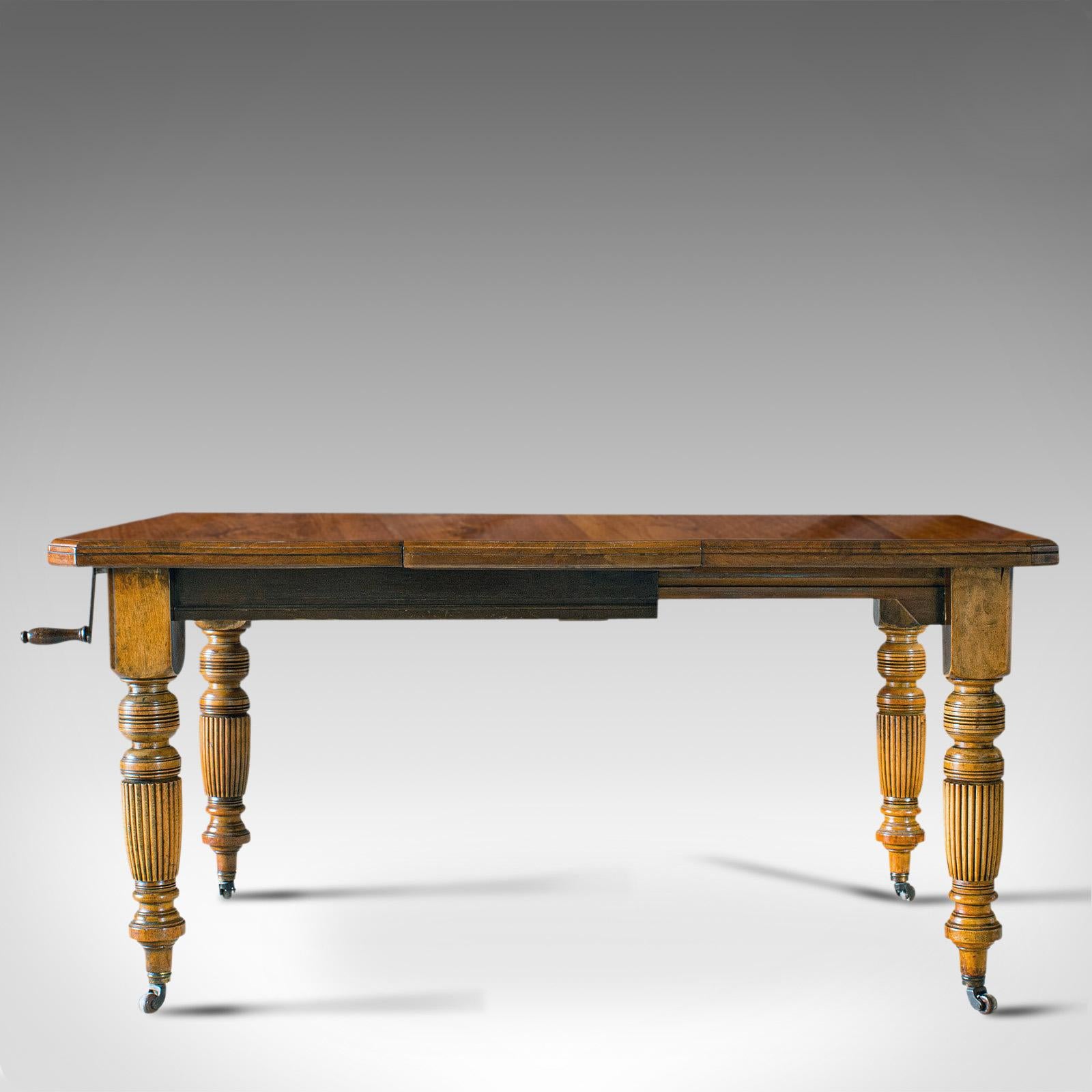This is an antique extending dining table. An English, walnut table seating 4-6 people, dating to the Victorian period, circa 1890.

Appealing antique dining table
Displays a desirable aged patina
Walnut shows fine grain interest
Rich, light