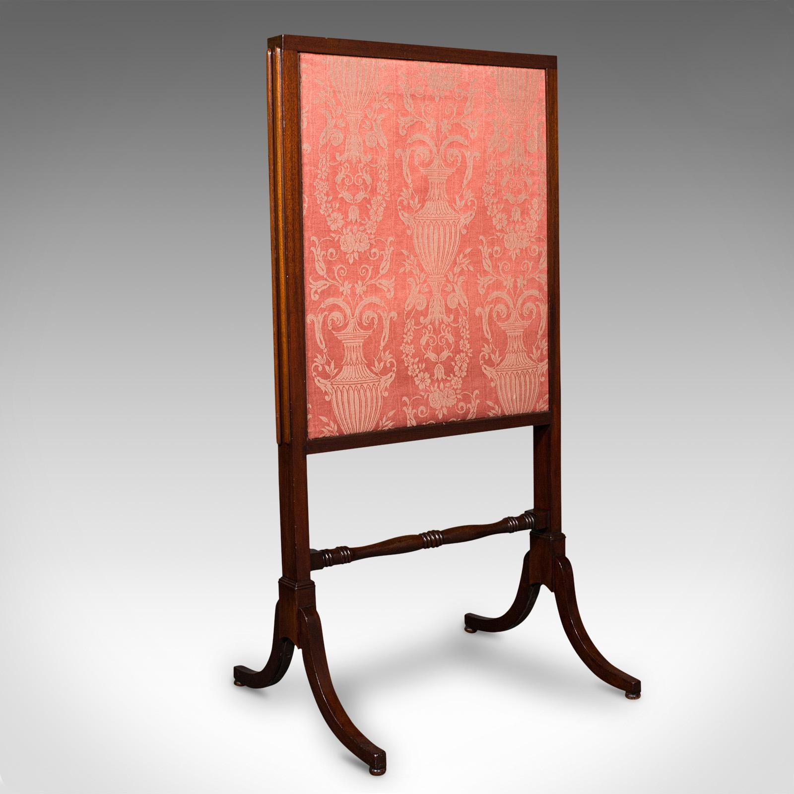 This is an antique extending fire screen. An English, mahogany and silk cotton fireside shield, dating to the mid Victorian period, circa 1860.

Fascinating three panel form to guard against the largest of fireplaces
Displays a desirable aged