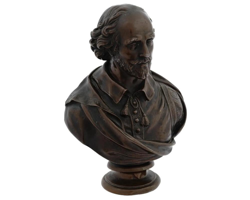 An antique monumental French patinated bronze bust of William Shakespeare after Jean Antoine Houdon, French, 1741 to 1828. Manufactured by F. Barbedienne Foundry. Circa: 1870. Masterfully and realistically sculpted in solid bronze. Marked with an