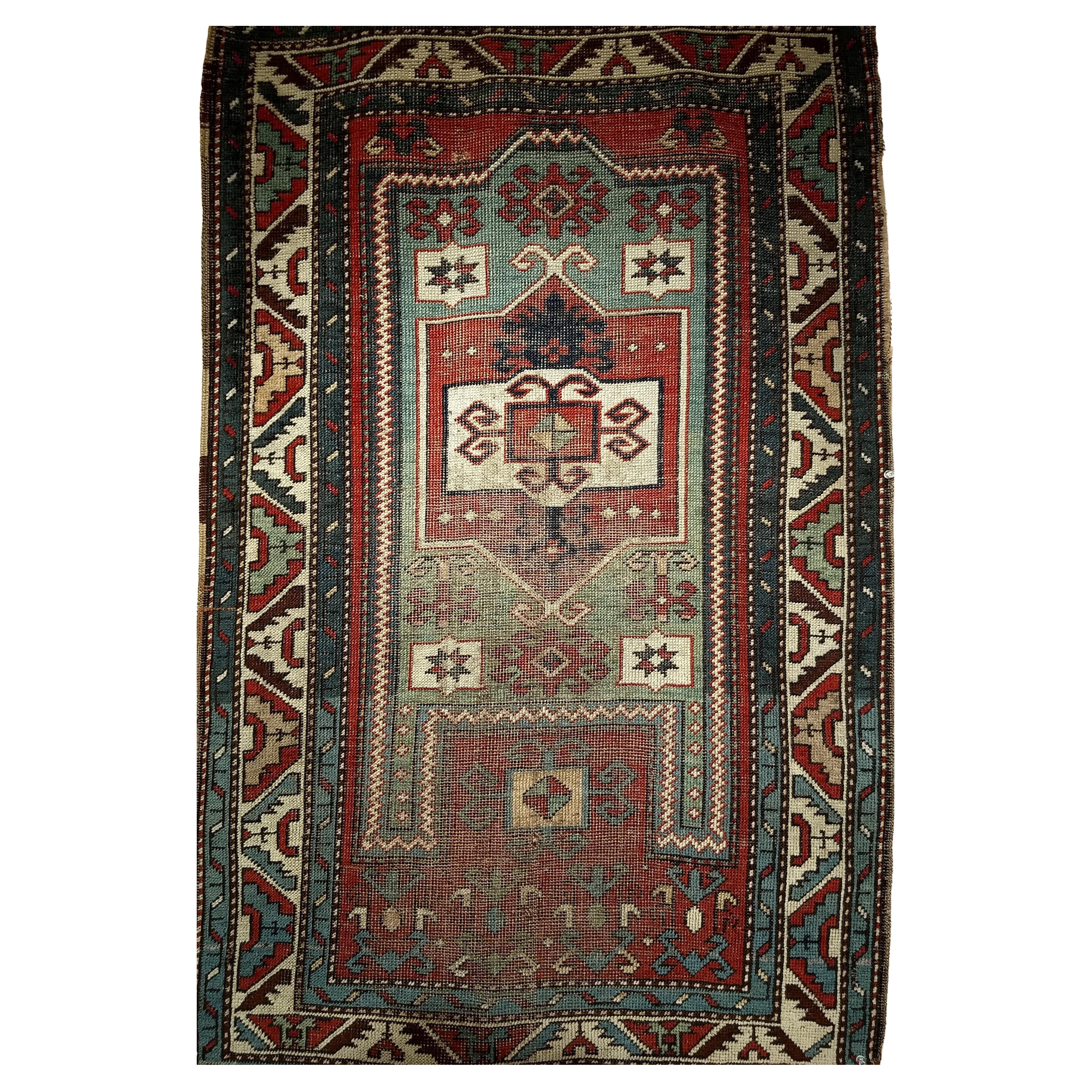 Antique Fachralo Kazak Area Rug in Red, Sage Green, Ivory, Blue (Tapis ancien de Fachralo Kazak en rouge, vert sauge, ivoire et bleu)