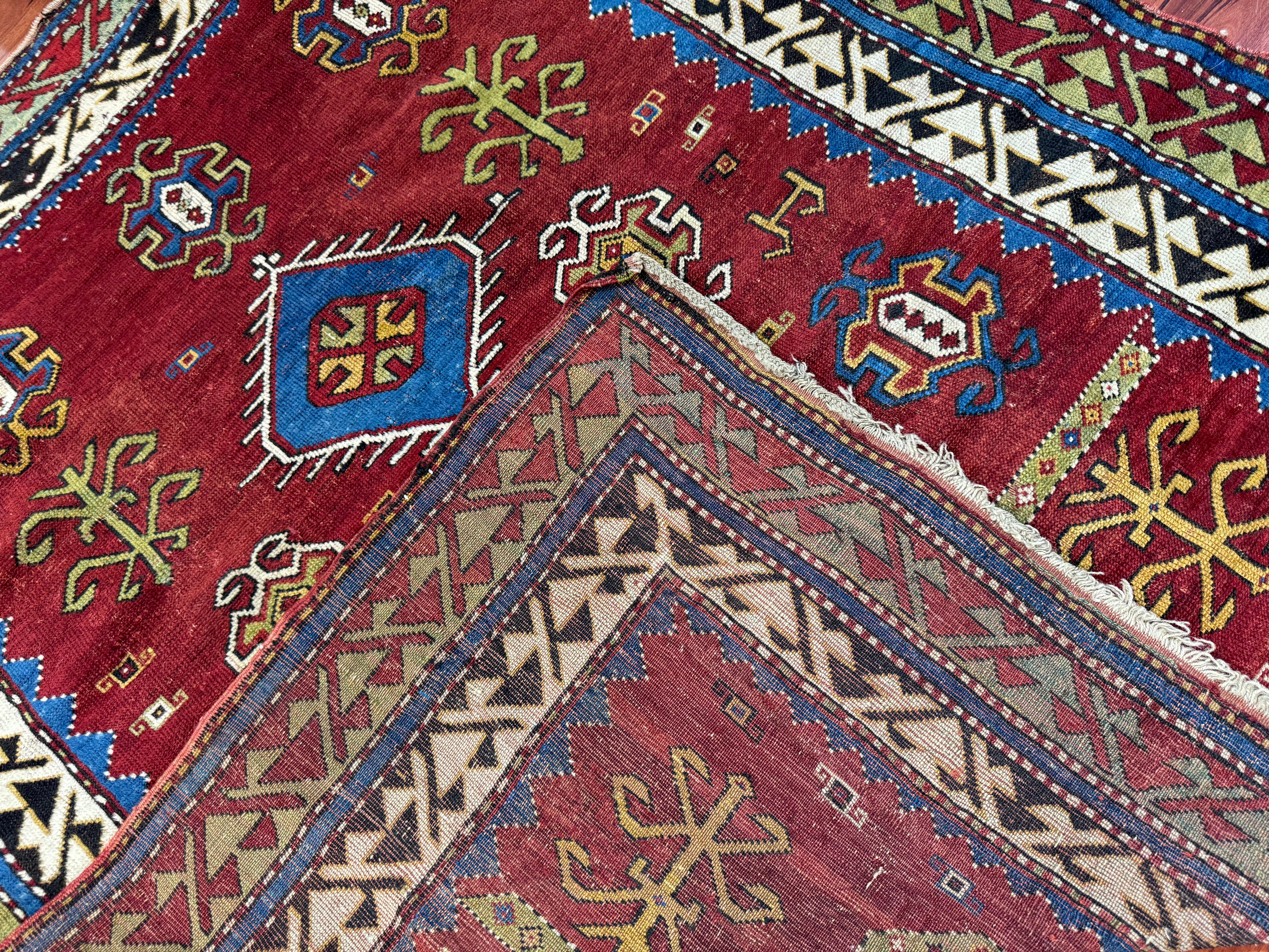 A stunning Antique Fachralo Kazak rug that measures in at 4’6” by 5’2” ft. This Rug is in excellent condition considering its rich history. Feel free to message me in regards to this listing or any other I have on my page!