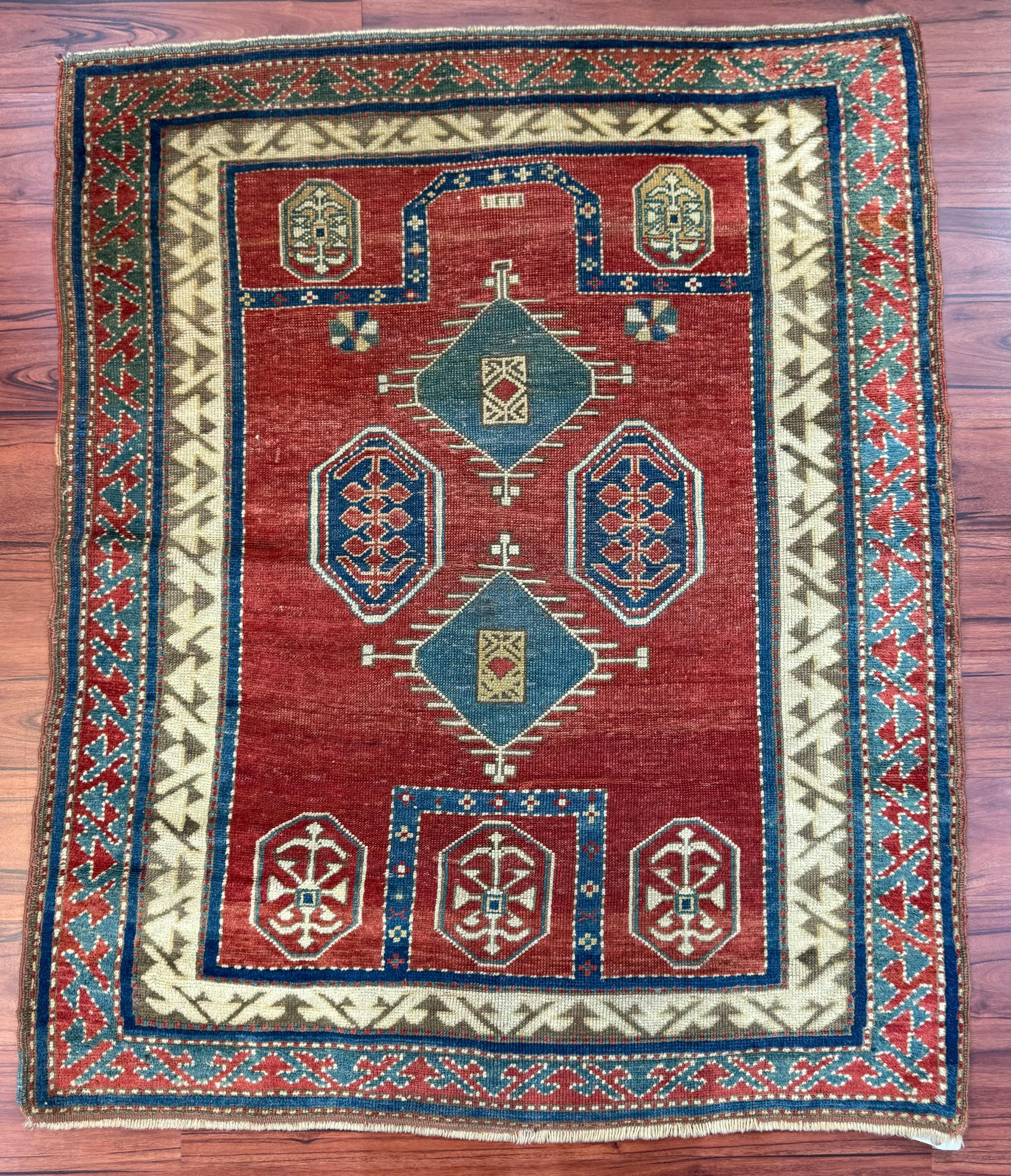 A stunning Antique Fachralo Kazak Rug that measures in at 3’9” by 4’8” ft. This rug is in excellent condition considering its rich history. Feel free to message me regarding this listing or any other I have on my page! 
