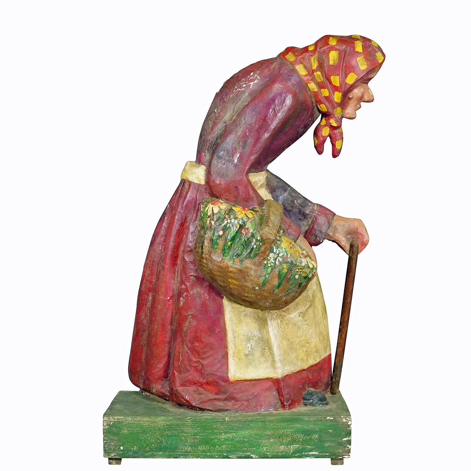 Antique Fairground Paper Mache Sculpture of a Witch or Farmer's Wive

A large half-relief sculpture of the witch from the fairy tale Hansel and Gretel. Probably used as decoration in a fairytale garden at a funfair. Handmade from papier-mâché on a