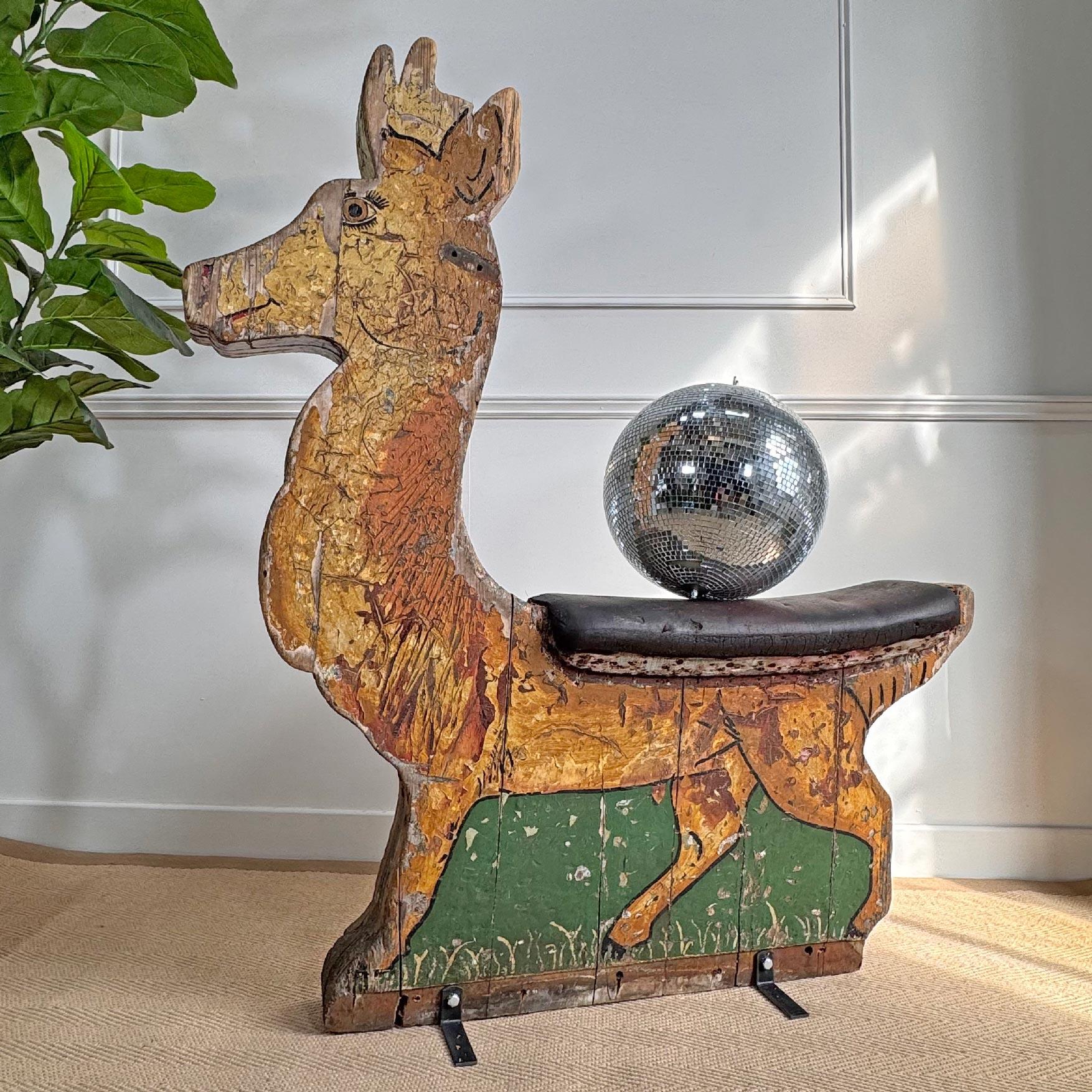 Large 1930's Antique English fairground wooden Reindeer carousel ride. Wonderful aged patina, two sided original paint. Faux leather padded seat. Has been fitted with cast iron brackets so it can stand freely.  



Height 126 cm x Width 106 cm x