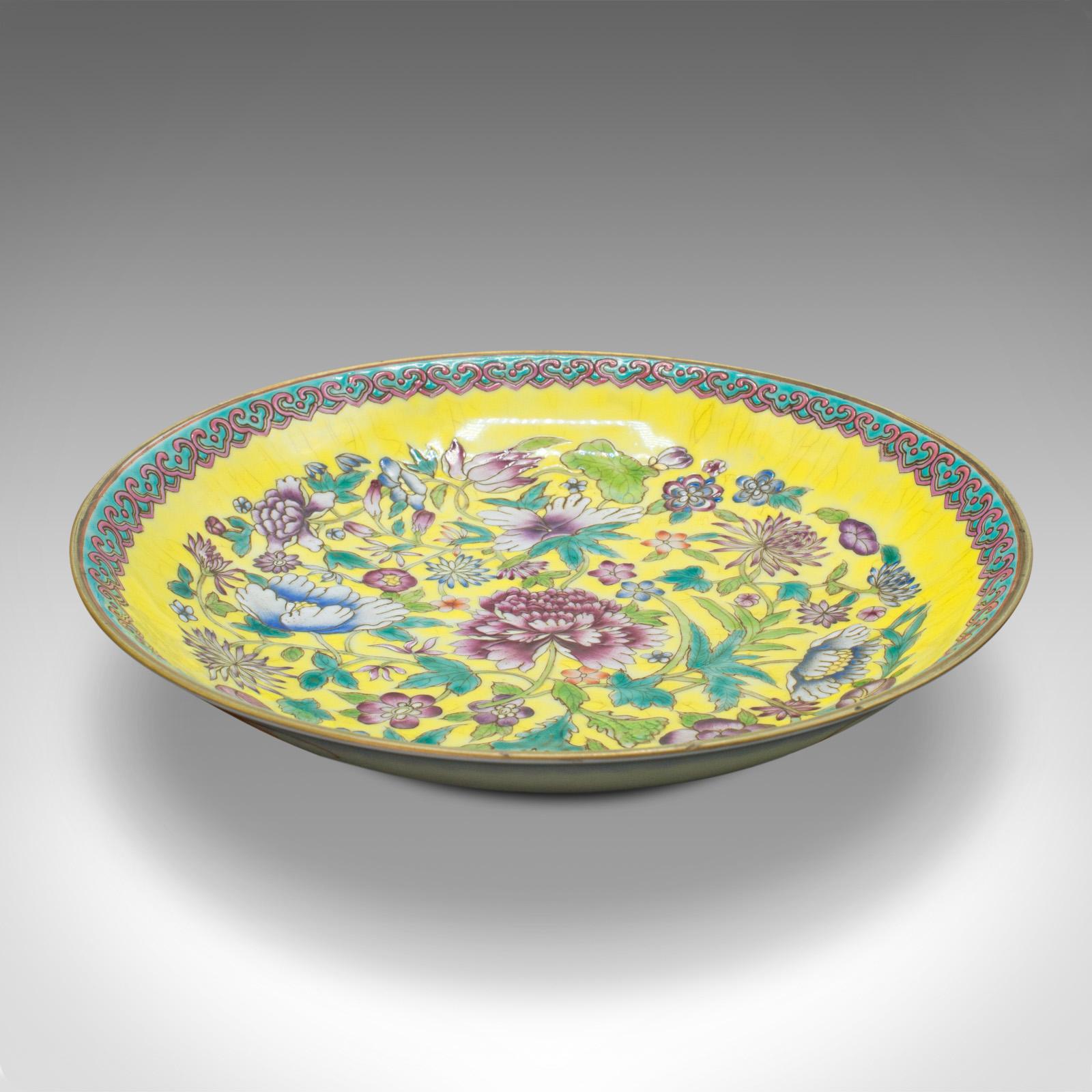 This is an antique Famille Jaune decorative dish. A Chinese, ceramic display plate, dating to the late Victorian period, circa 1900.

Delightfully vibrant palette to this attractive dish.
Displays a desirable aged patina and in superb