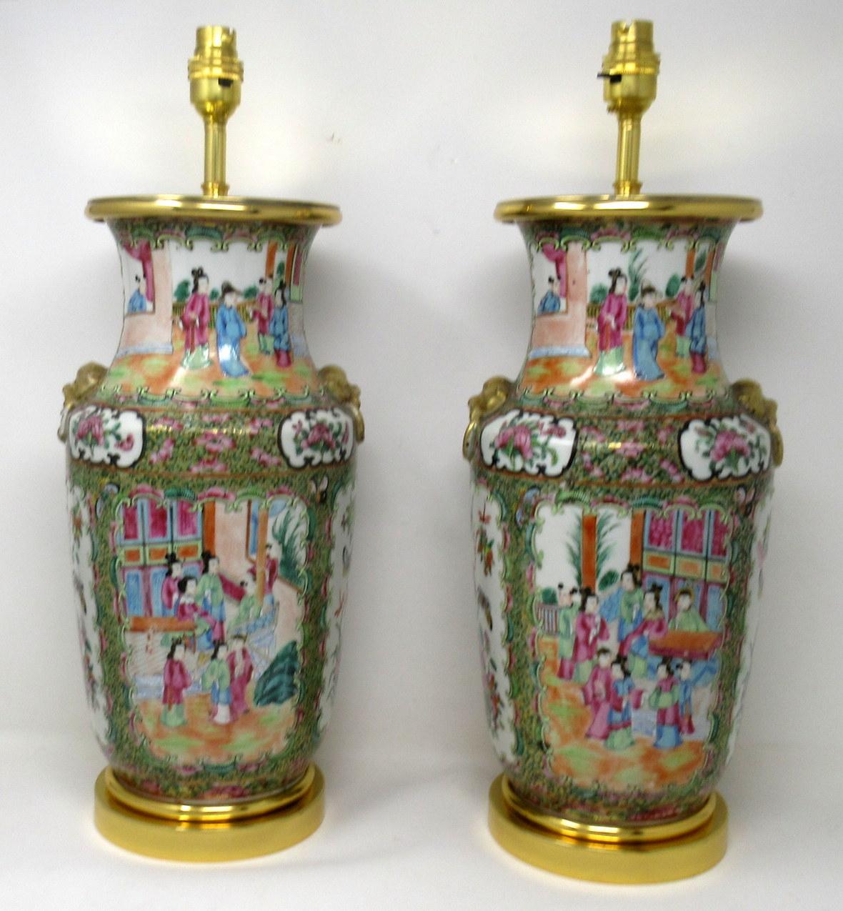 An Exceptionally Fine Pair of Cantonese Hand Decorated Porcelain Oil Lamps with ornate Ormolu bases now converted to Electric Table Lamps, of good size proportions, (see last image in situ) mid Nineteenth Century. 

The main outer bodies of