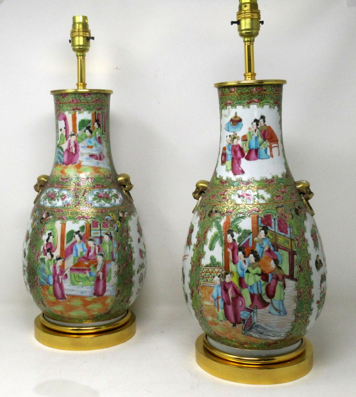 An exceptionally fine pair of Chinese Cantonese hand decorated porcelain oil lamps with ornate Ormolu bases now converted to Electric Table Lamps, of good size proportions, (see last image in situ) mid Nineteenth Century. 

The main outer bodies of