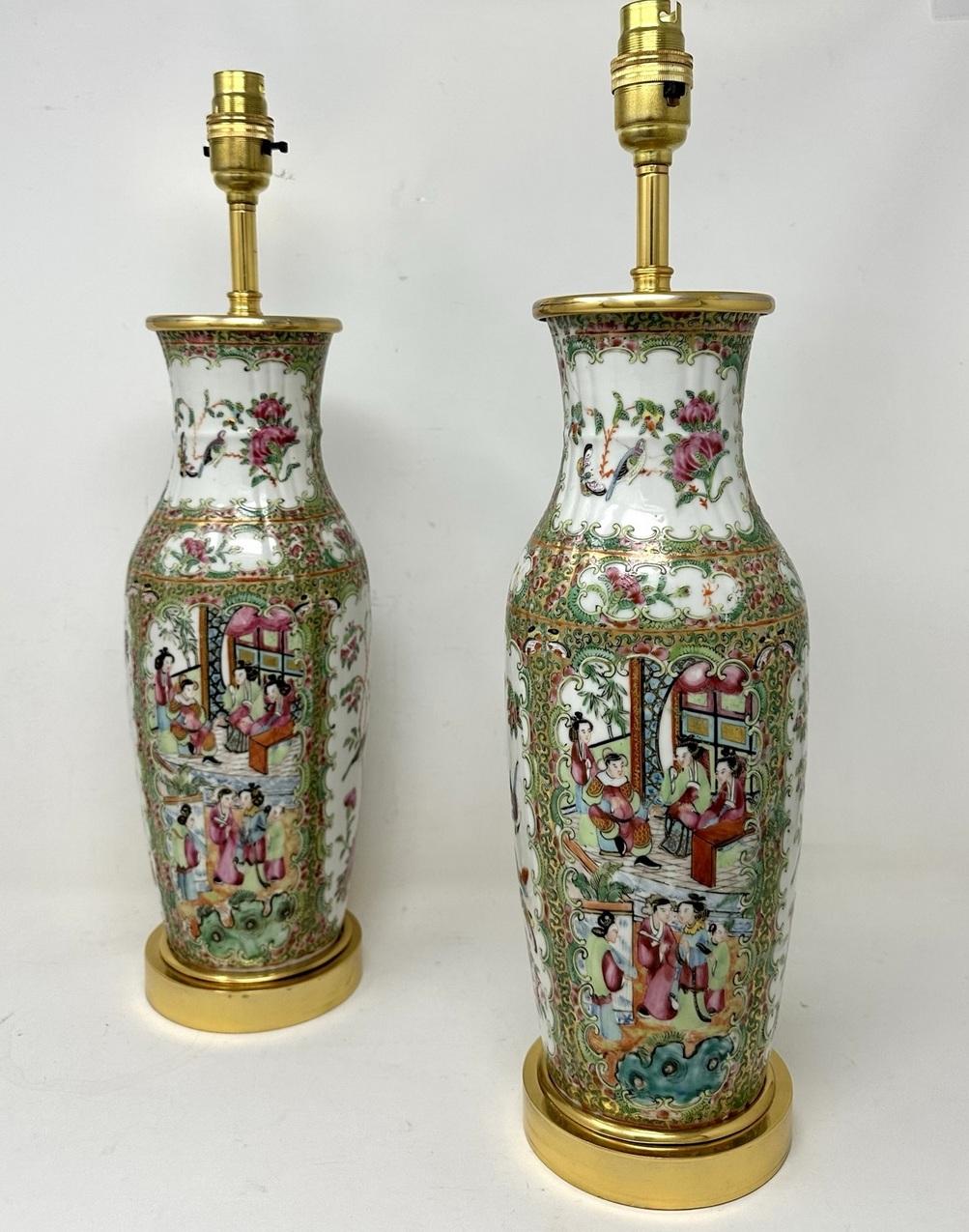 An Exceptionally Fine Pair of Cantonese Hand Decorated Porcelain Oil Lamps with ornate Ormolu bases now converted to Electric Table Lamps, of good size proportions, (see last image in situ) mid Nineteenth Century. 

The main outer bodies of bulbous