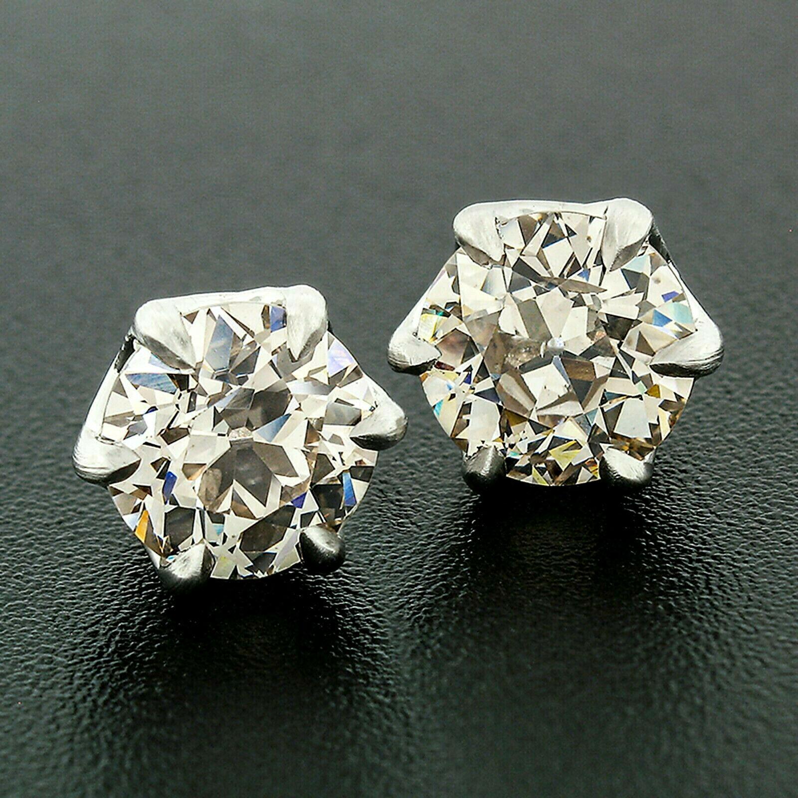 These fancy antique diamond stud earrings are crafted in new and secured solid platinum mountings. They feature a total of 3.17 carats in 2 old European cut diamonds perfectly claw prong set in the well and solidly made baskets. The diamonds are
