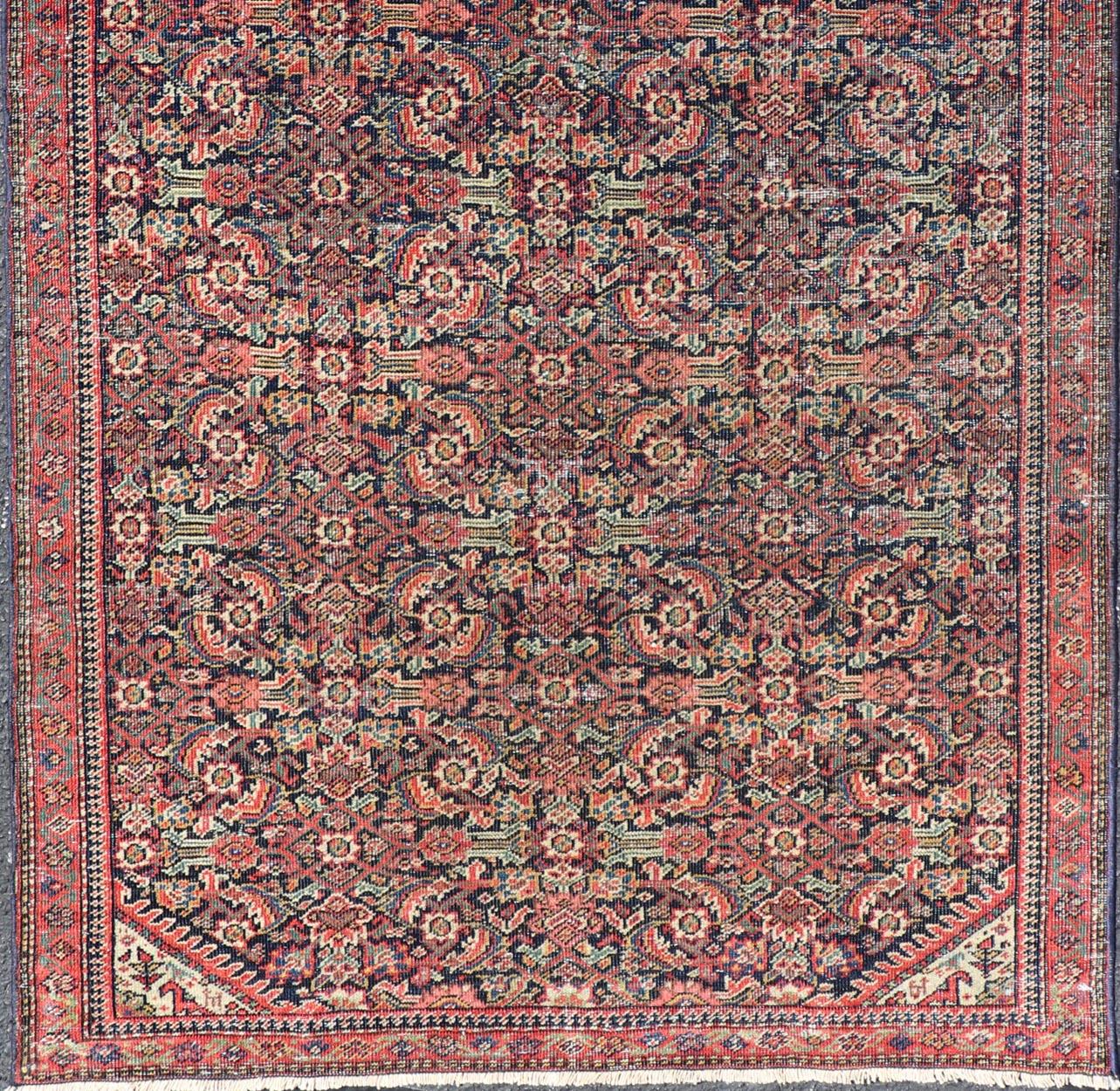 Antique Faraghan fine Persian rug in Navy Color Background And Jewel Tones. Rug / R20-1003 / Type / Iran / Faraghan / Circa early 20th century.
Measures: 2'10 x 5'6. 
This exquisite antique Faraghan fine Persian rug displays a rich palette of