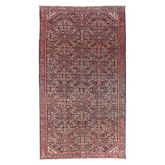 Tapis persan ancien avec fond de couleur marine et tons de bijoux
