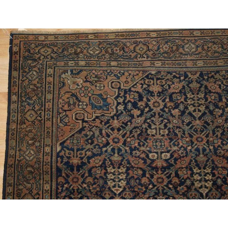 Antique Faraghan rug of the garden shrub design with a single medallion. This is a very good example of a Faraghan rug with fine weave and a very well drawn shrub design in a lattice format with a small central medallion. The colours give a very