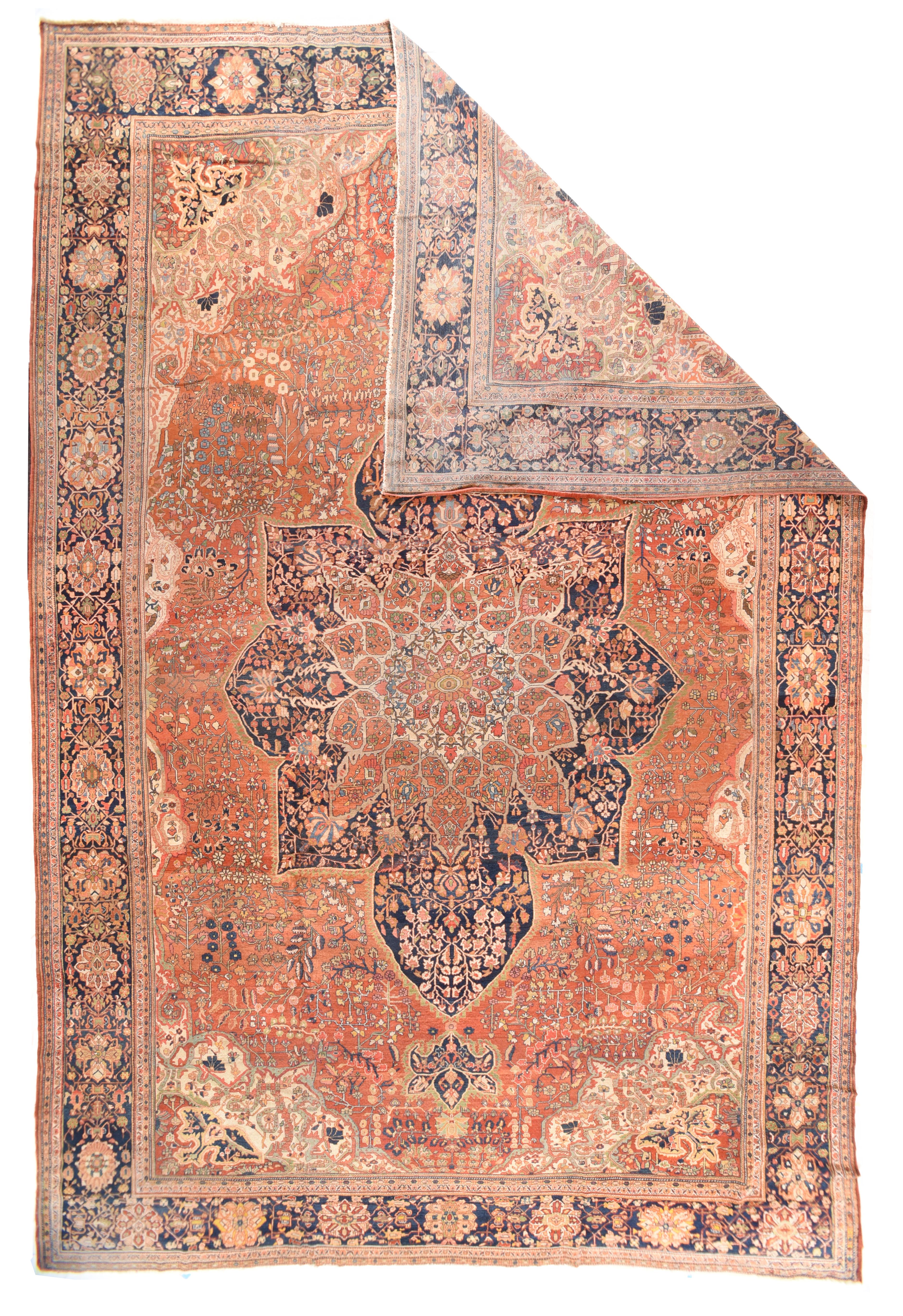 Antique Farahan Sarouk Rug 13'2'' x 19'. The tall, navy pointed octogramme medallion is detailed with palmettes growing from the longer points of the 16 point central rust sub-medallion. At each internal end of the medallion are off white flower