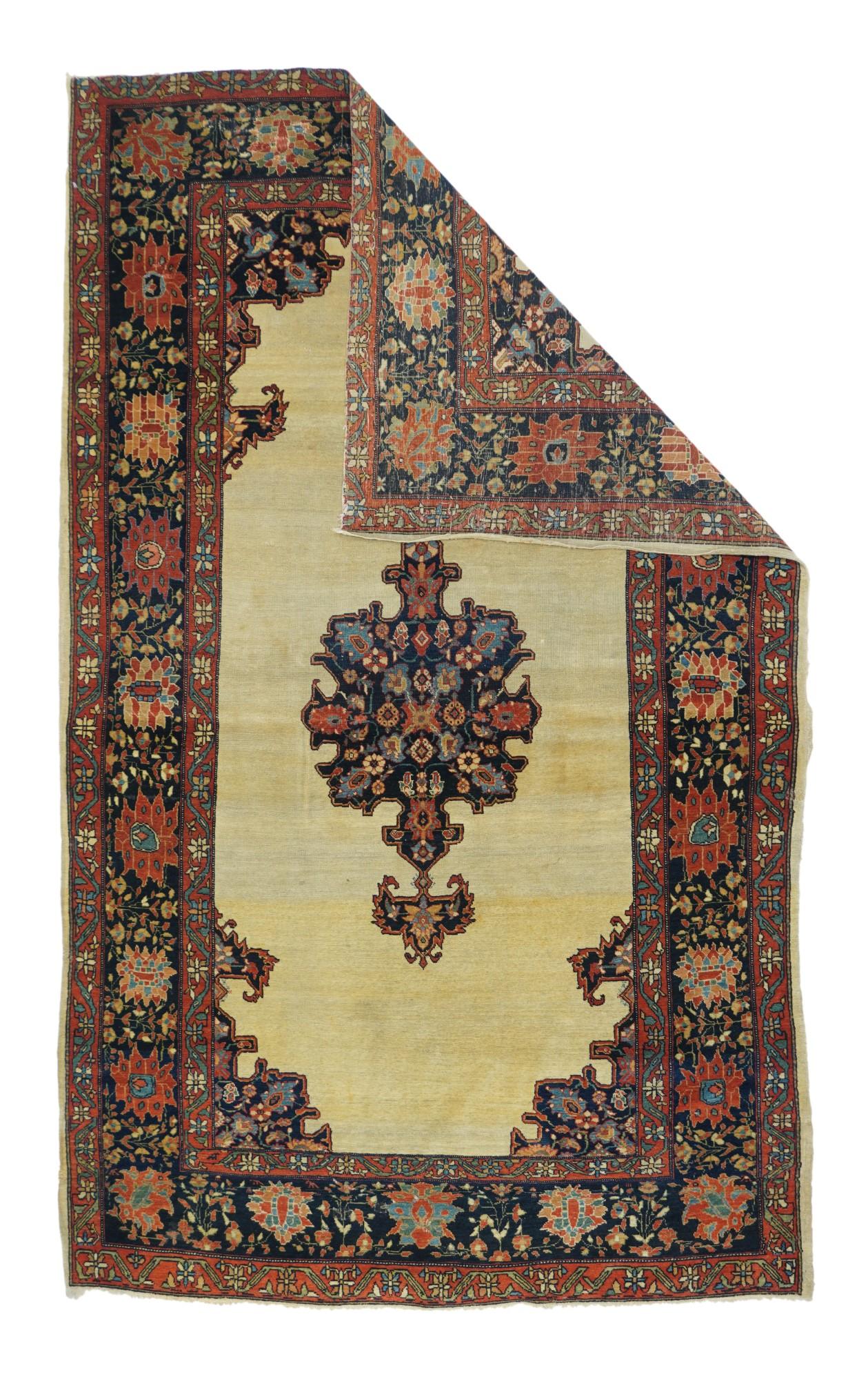 This scatter is one of the most desirable of Ferahan-Sarouk types with its contrast of a very subtly abrashed open sandy-cream field and crisp navy pendanted medallion with closely en suite corners. The small palmette and flower decoration in the