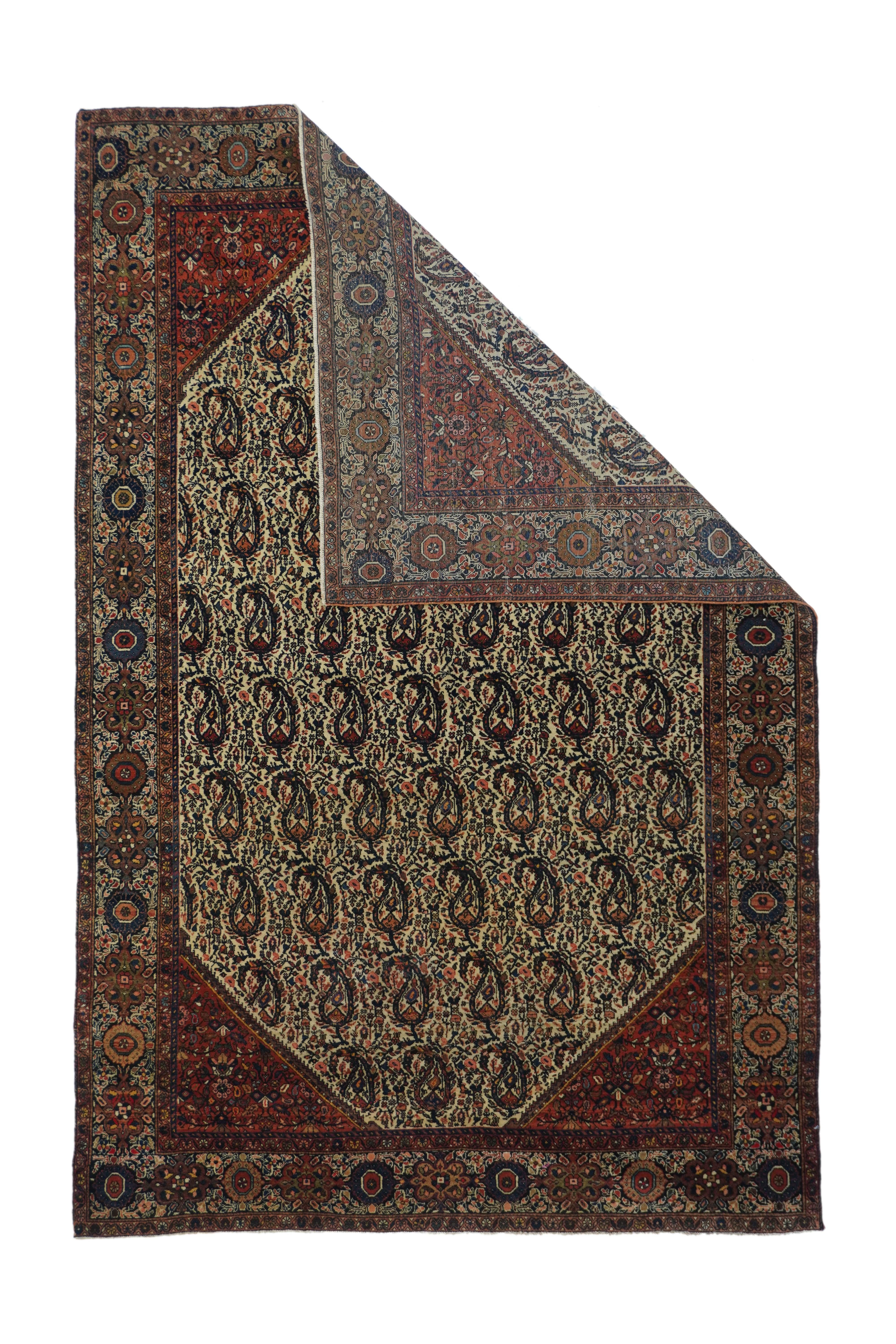 Antique Farahan Sarouk rug 4'3'' x 6'5''. Here is a well-woven village scatter with an elongated octagonal ecru field decorated with offset rows of unidirectional botehs, with a dense broken and floriated vinery between, and within stepped red