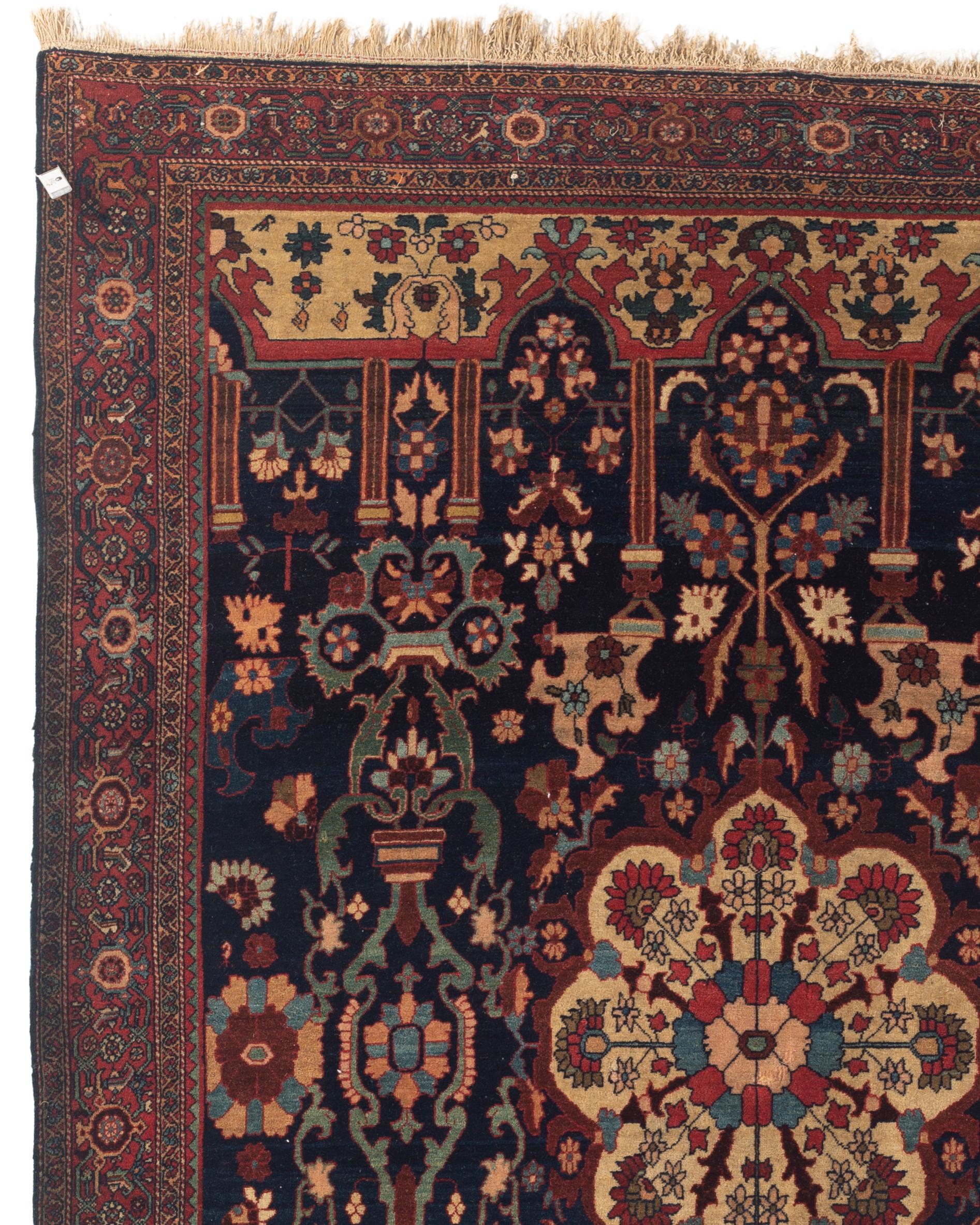 Antique Farahan Sarouk rug, circa 1880. Sarouk rugs come from west central Persia. A deep navy ground with a central ivory medallion woven showing flowers and the ivory design at either end of the rug give an open feel that is aided by the main