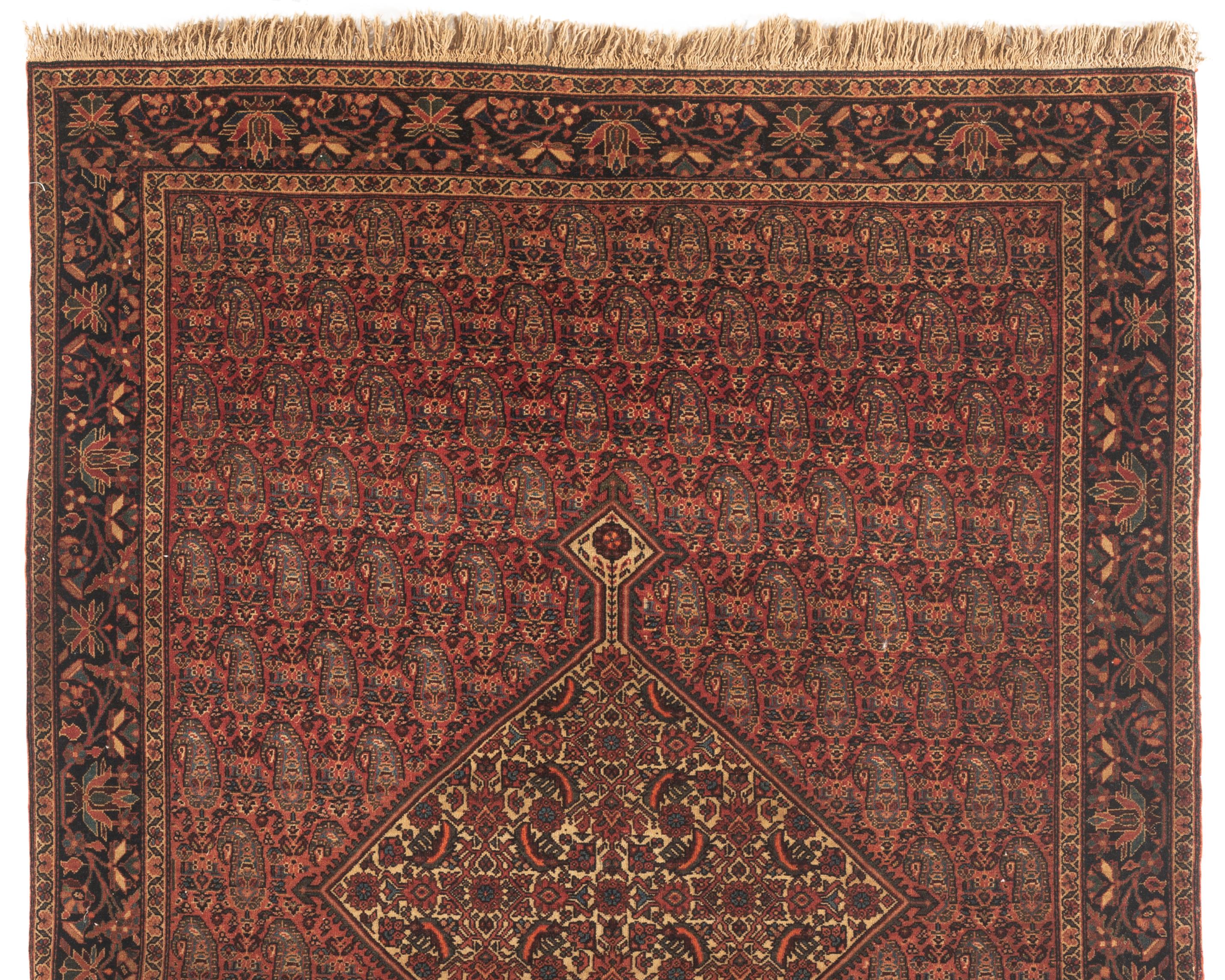 Antique Farahan Sarouk rug circa 1890. Sarouk rugs come from west central Persia. A wonderful detailed design on this rug, the central rust field full of boteh's surrounding and ivory ground enclosed by a navy border with floral designs. Size: 4'2 x