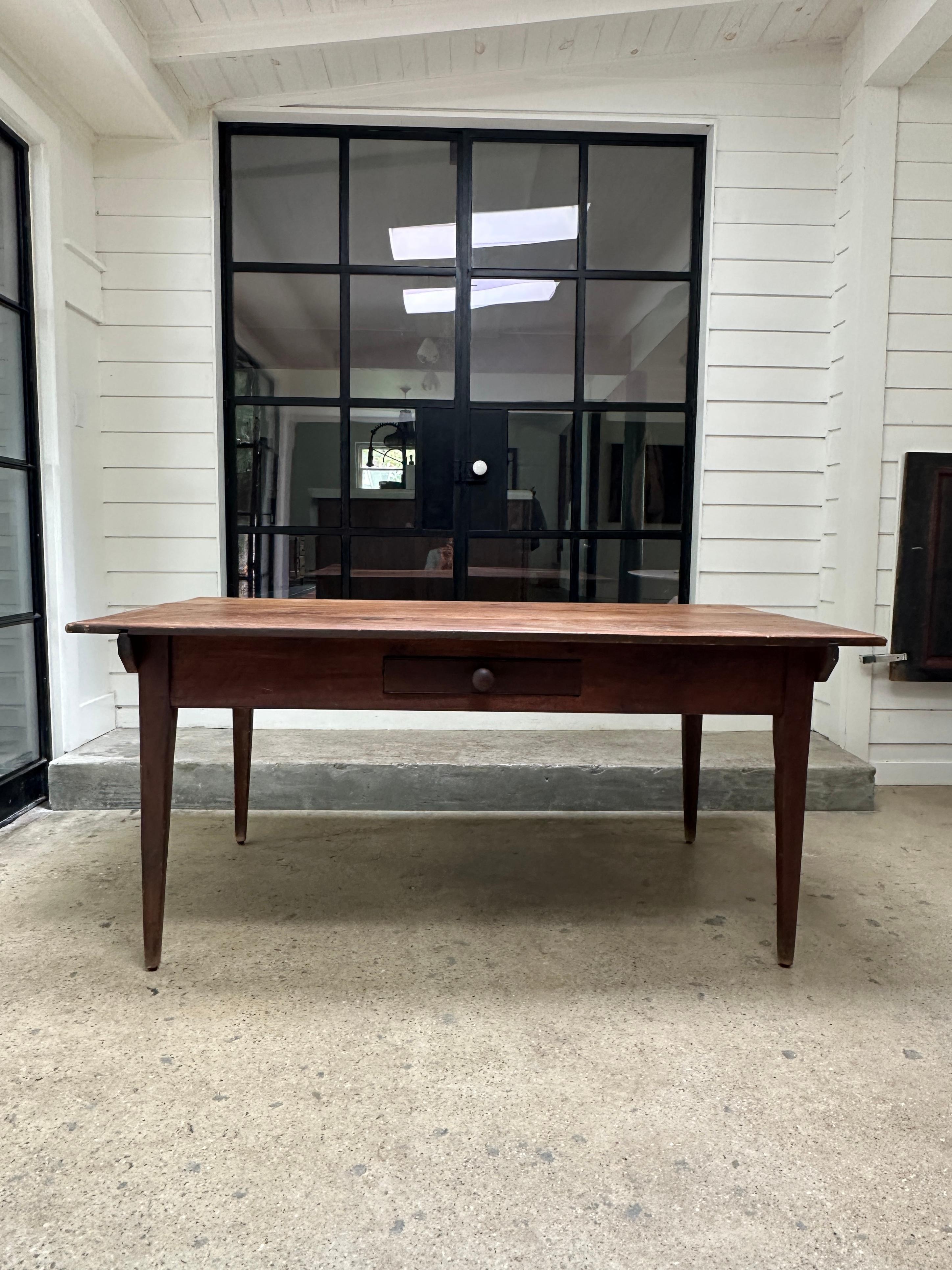 Antique country style farm dining table featuring a deep pull out drawer.

Circa 1890’s

64”W x 36”D x 28.5”H