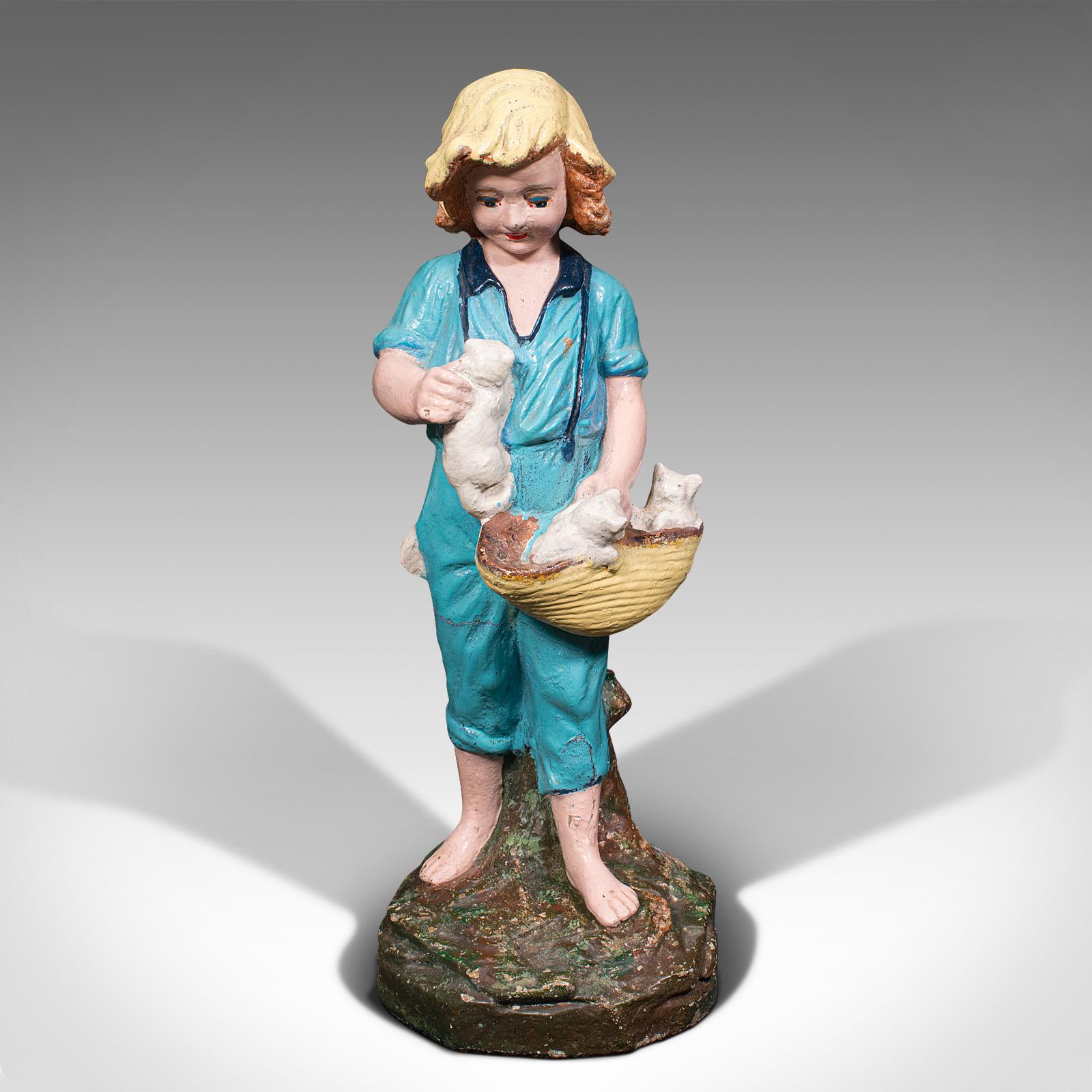 This is an antique farm girl figure. A French, reconstituted stone decorative statue with provincial appeal, dating to the late Victorian period, circa 1900.

Pleasingly jovial figure with feline interest
Displays a desirable aged patina - some