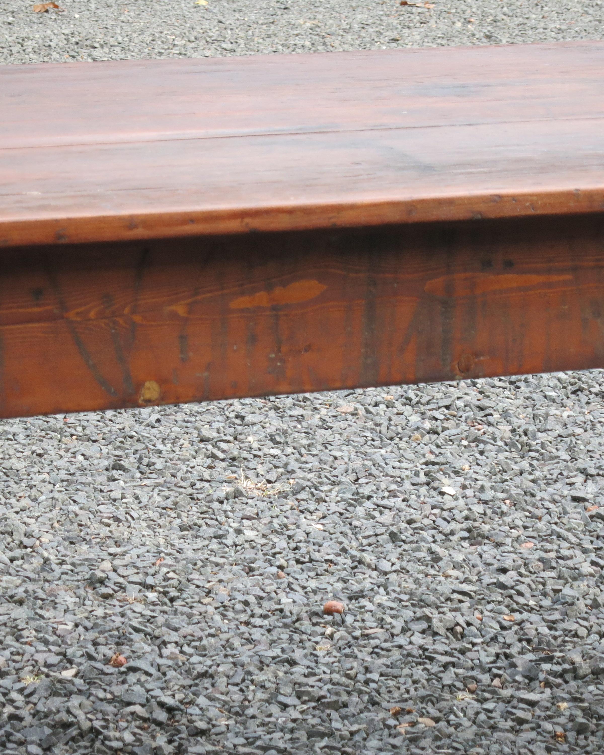 Beautifully worn antique farm table. Was probably stripped at some point. Age cracks and distress. Indentation on top. Solid table with clean style. Measures: It is 32.5