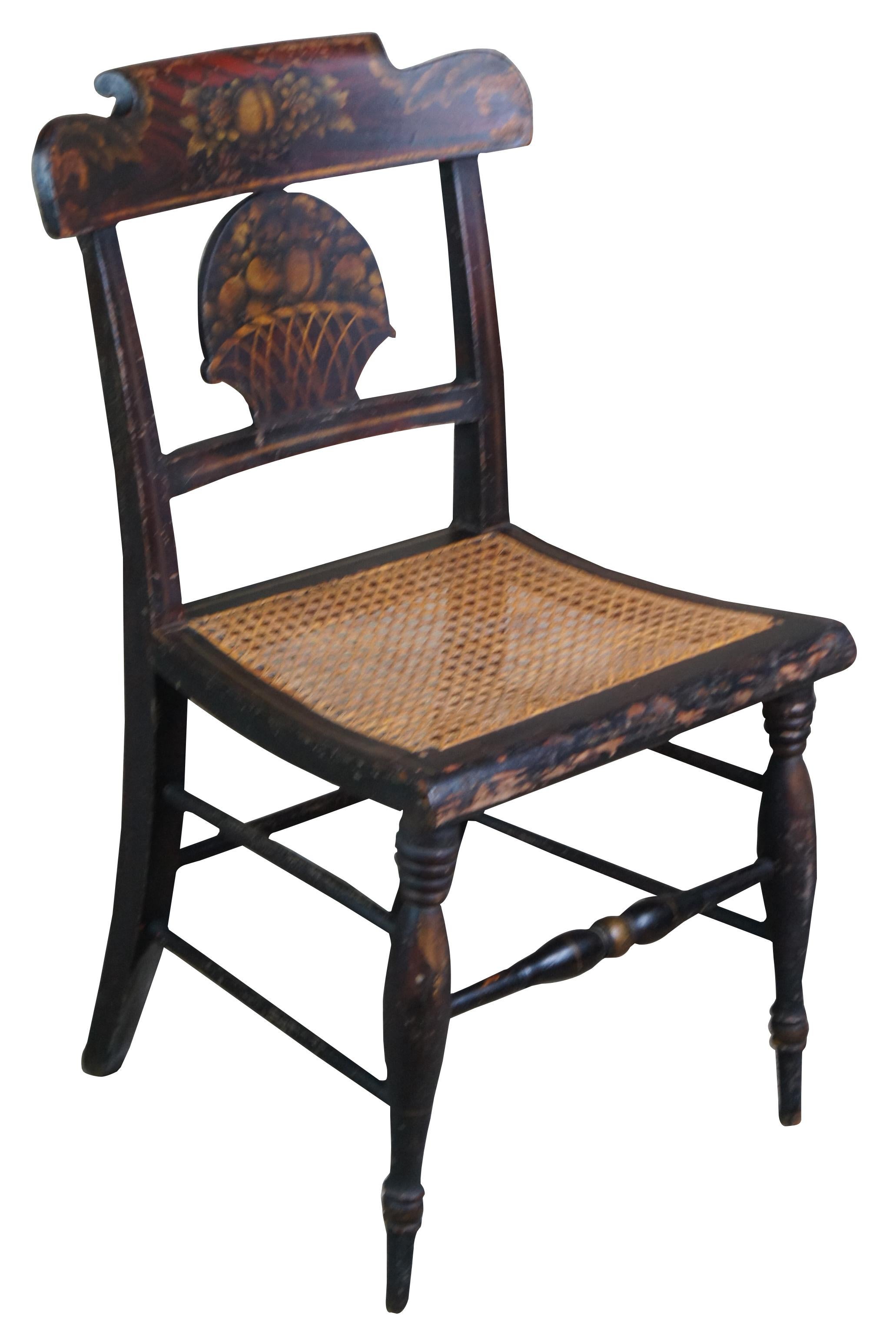 Mid-19th century stenciled Hitchcock dining chair featuring a fruit basket shaped back splat and cane seat. Measure: 33