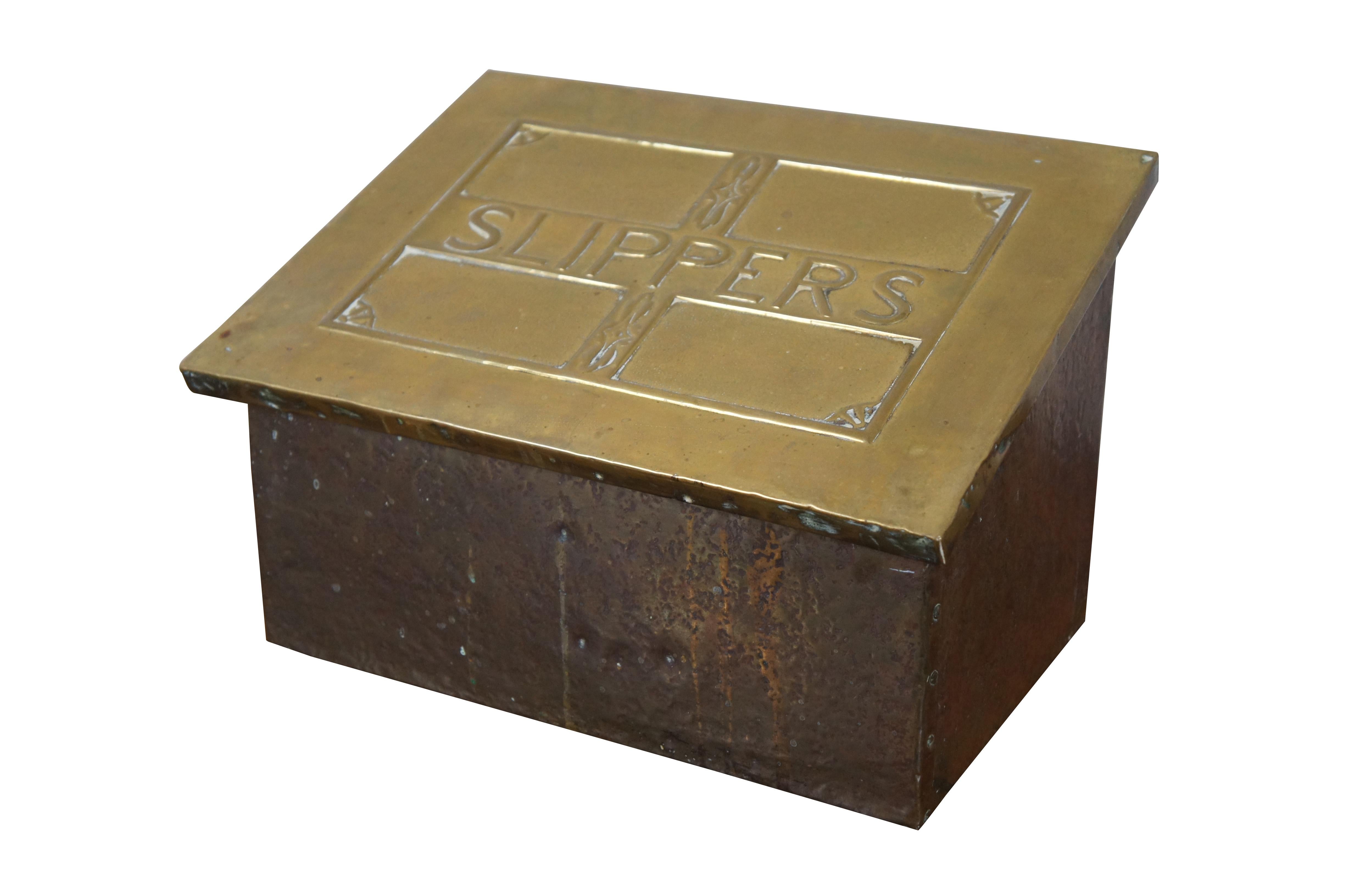 Late 19th century brass and wood lined slipper box. Rectangular form with sloped flip top lid, embossed with the label “Slippers” in a simple but elegant frame. Traditionally placed by the fireside to warm one’s house slippers in before