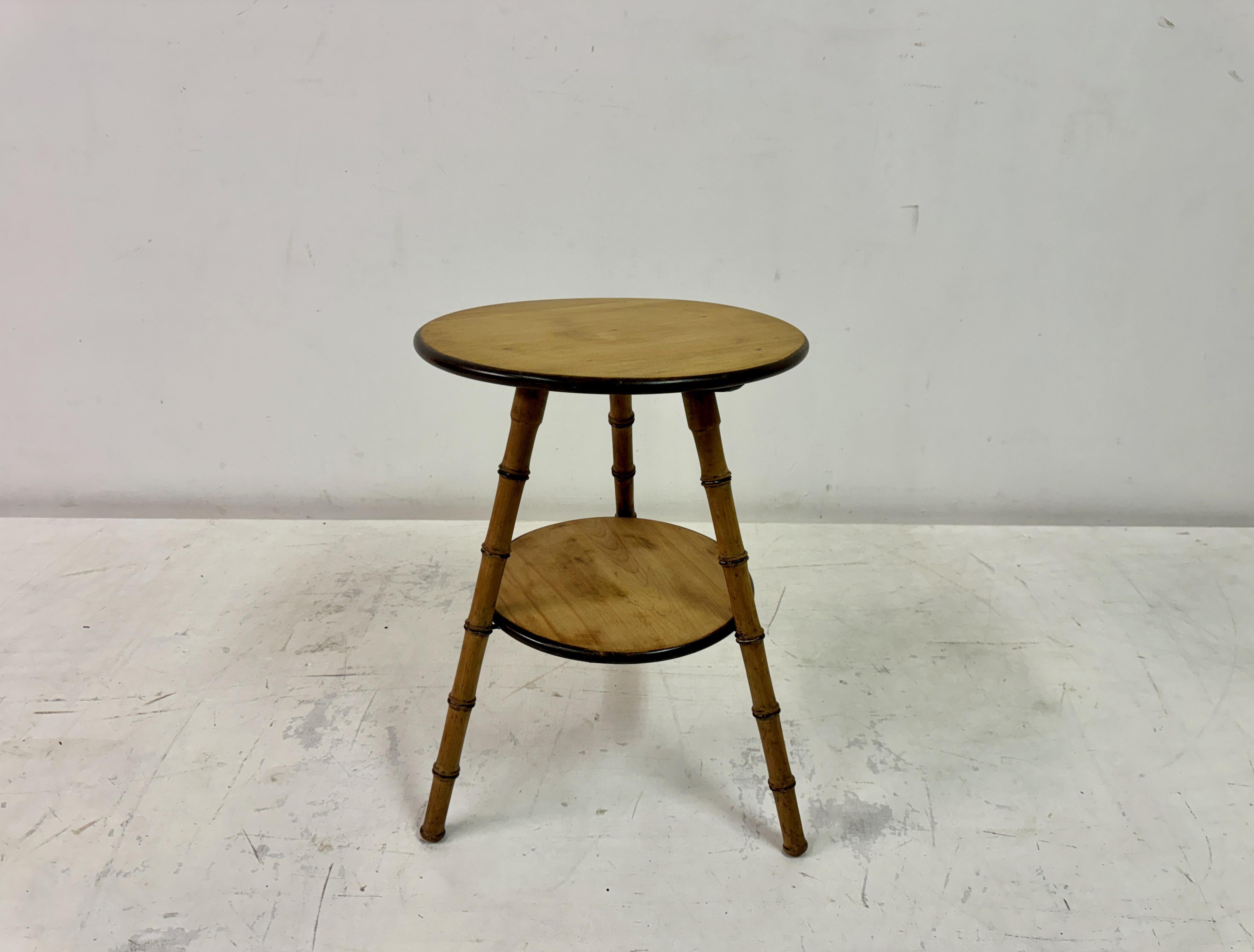 Faux Bamboo two-tier side table

This elegant Victorian-inspired side table features a two-tier design with a faux bamboo construction, capturing the exotic charm of bamboo furniture popular in the 19th century. The table’s circular top and lower