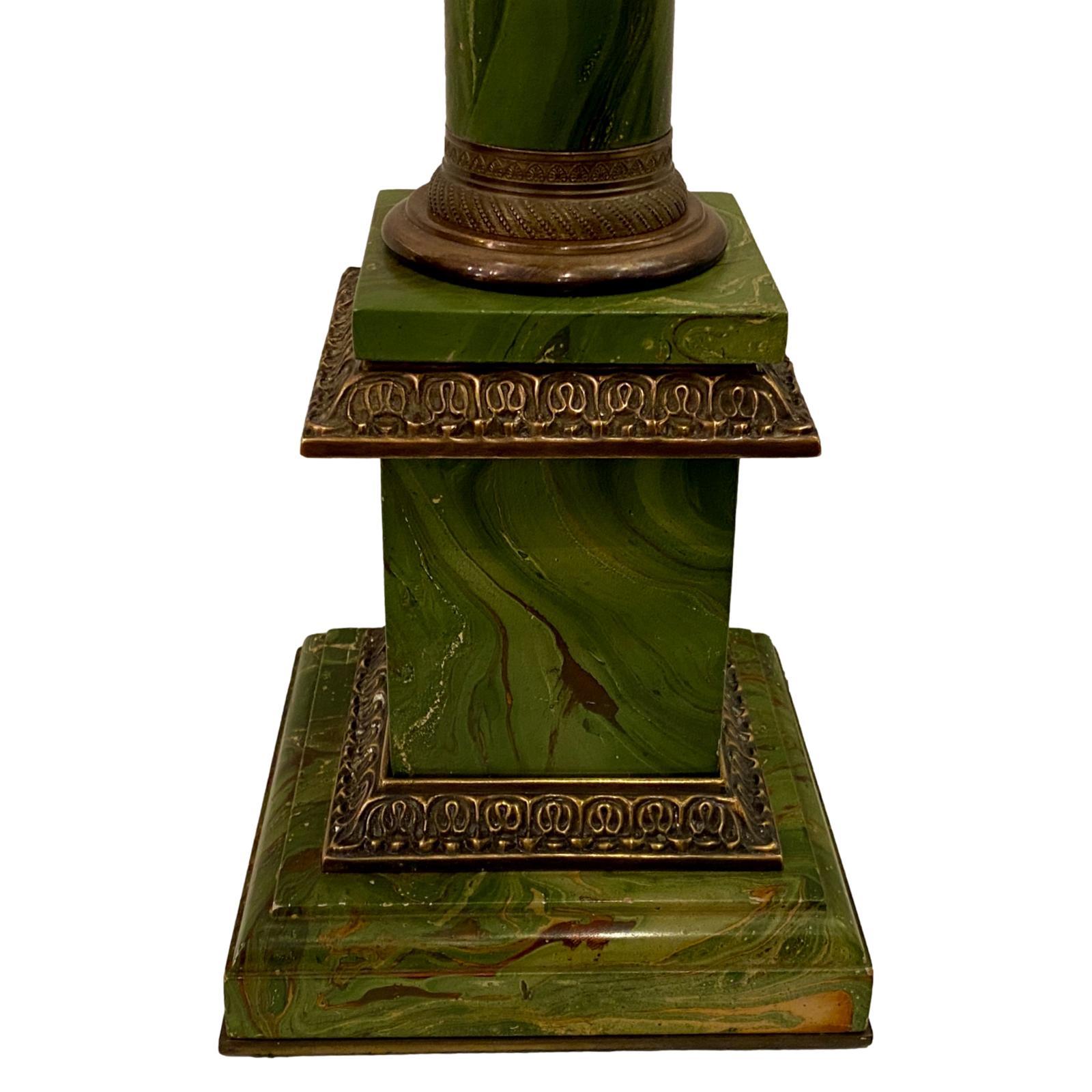 A single circa 1920's French painted tole table lamp with faux marble finish and bronze fittings.

Measurements:
Height of body: 22