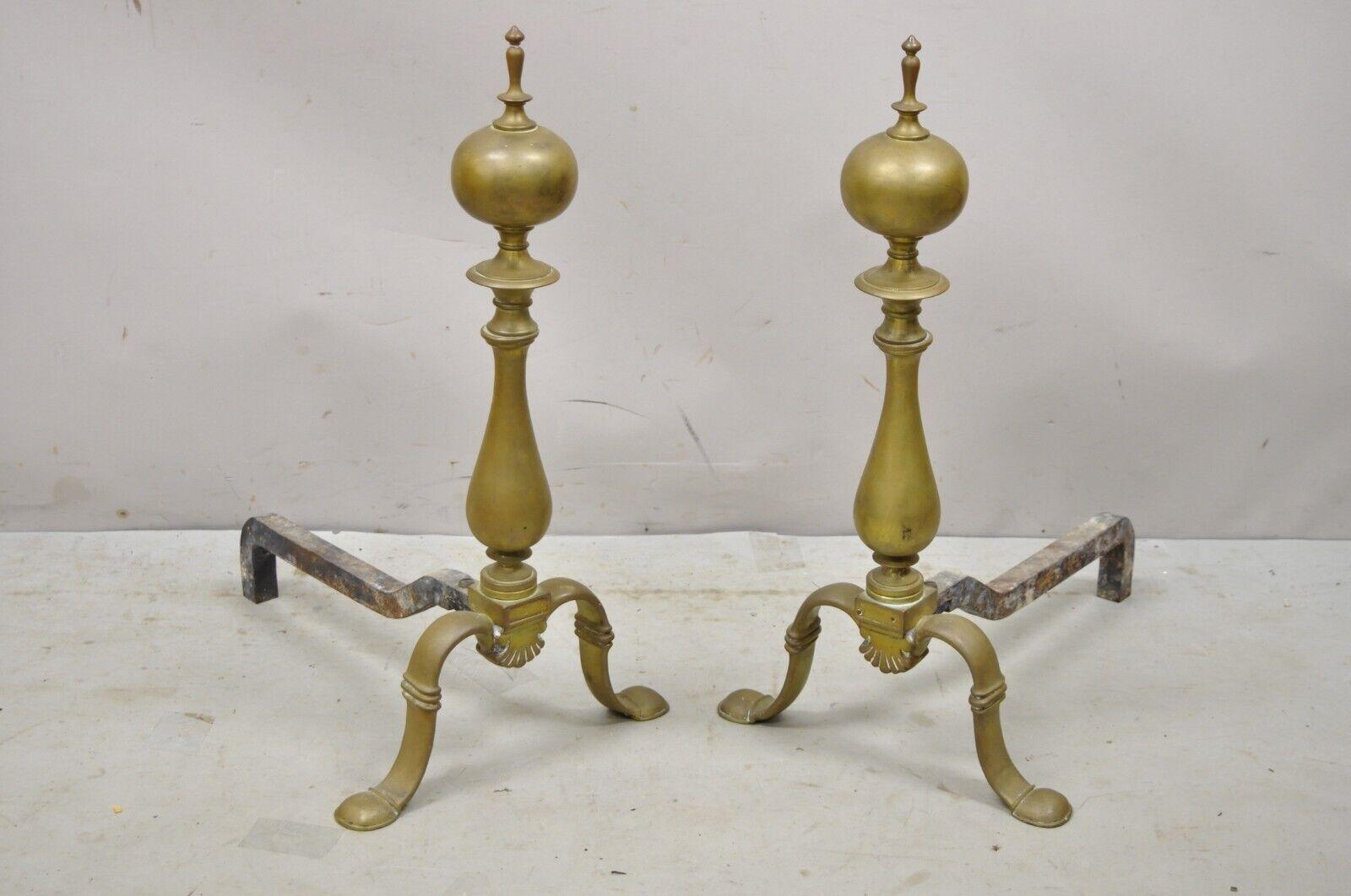 Antique Federal brass cannonball cast iron fireplace Hearth Andirons - a Pair. Item features solid brass construction, shapely legs, cast iron supports, very nice antique pair, quality craftsmanship, great style and form. circa 19th century.
