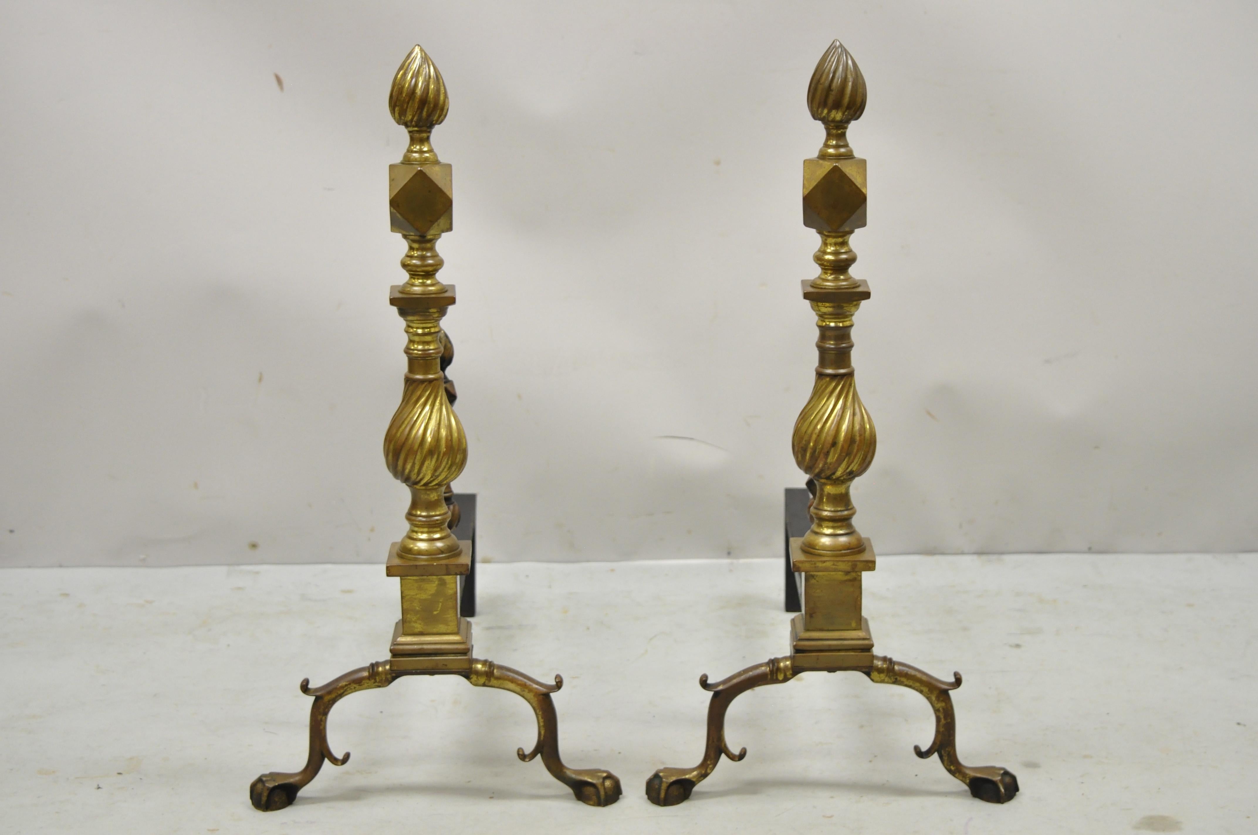 Antique English Federal brass and cast iron spiral twist finial branch legs ball & claw andirons. Item features remarkable authentic patina, spiral twist finial and column, branch legs, ball and claw feet, geometric form to column. Circa early