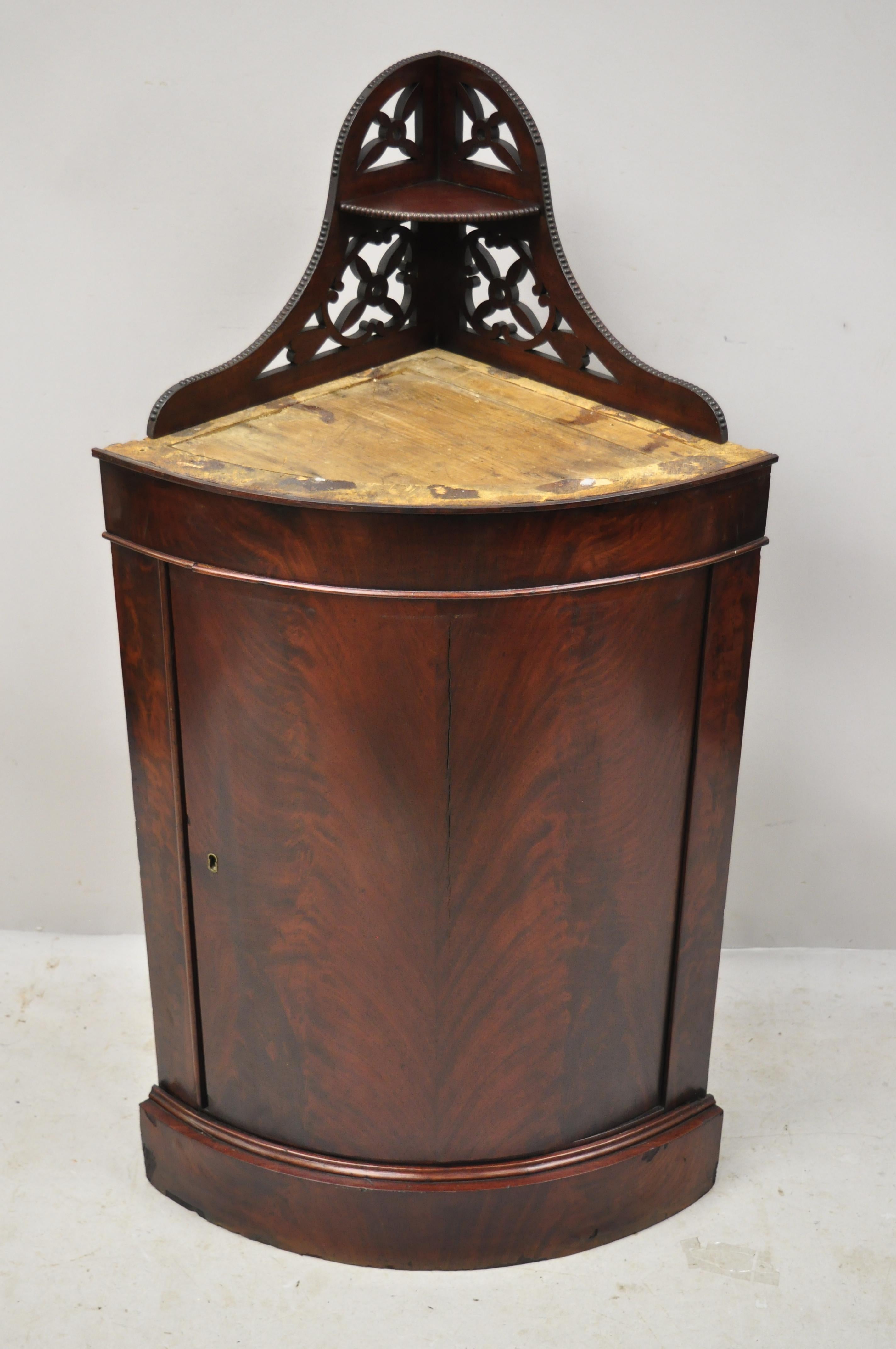 Antique Federal crotch mahogany small corner cabinet cupboard pedestal Stand. Item features beautiful wood grain, 1 swing door, no key, but unlocked, 1 wooden shelf, very nice antique item, quality American craftsmanship. Probably had a wood or