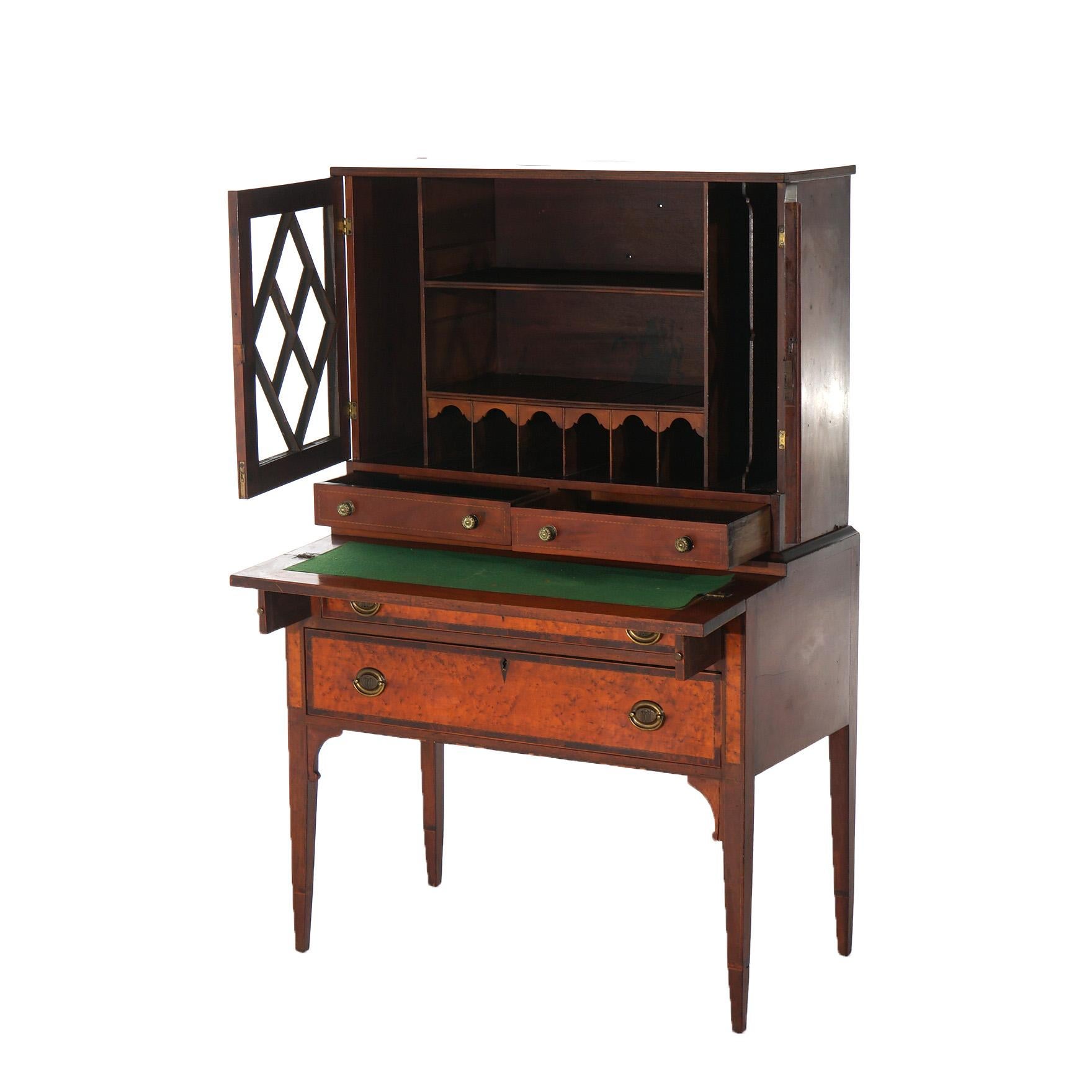 ***Ask About Reduced In-House Shipping Rates - Reliable Service & Fully Insured***
An antique Federal or Hepplewhite secretary offers birdseye maple and mahogany construction with upper case having double lattice and glass doors opening to shelved