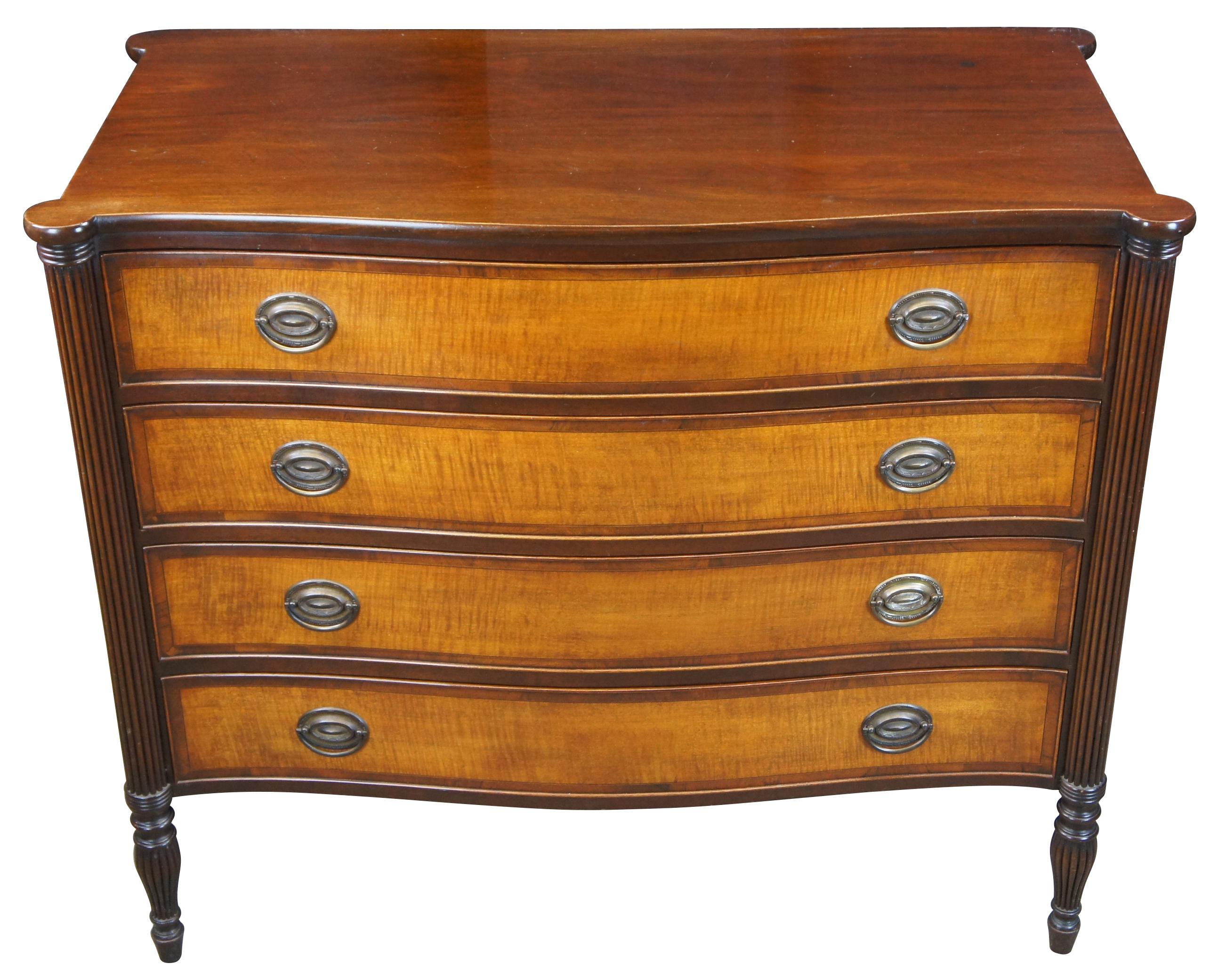 Antique American Federal or Sheraton serpentine chest of drawers, circa second quarter 20th century. Made from mahogany with turret reeded stiles, turnip turned legs and inlaid birch flamed drawers.
 