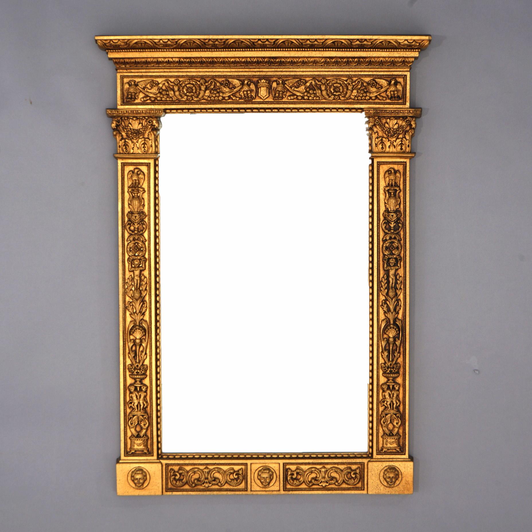 An antique Federal style Wall mirror offers gold finish with eagles, masks, foliate elements and caryatids, c1920

Measures - 34.5