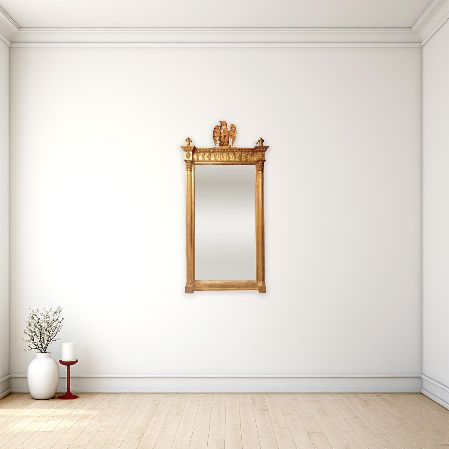 Miroir de style fédéral ancien orné de bois doré surmonté d'un aigle américain

Anonyme
États-Unis d'Amérique ; probablement début du 20e siècle
Bois doré, verre

Dimensions approximatives : 55 (h) x 27 (l) x 3 (p) in.

Cet élégant miroir est