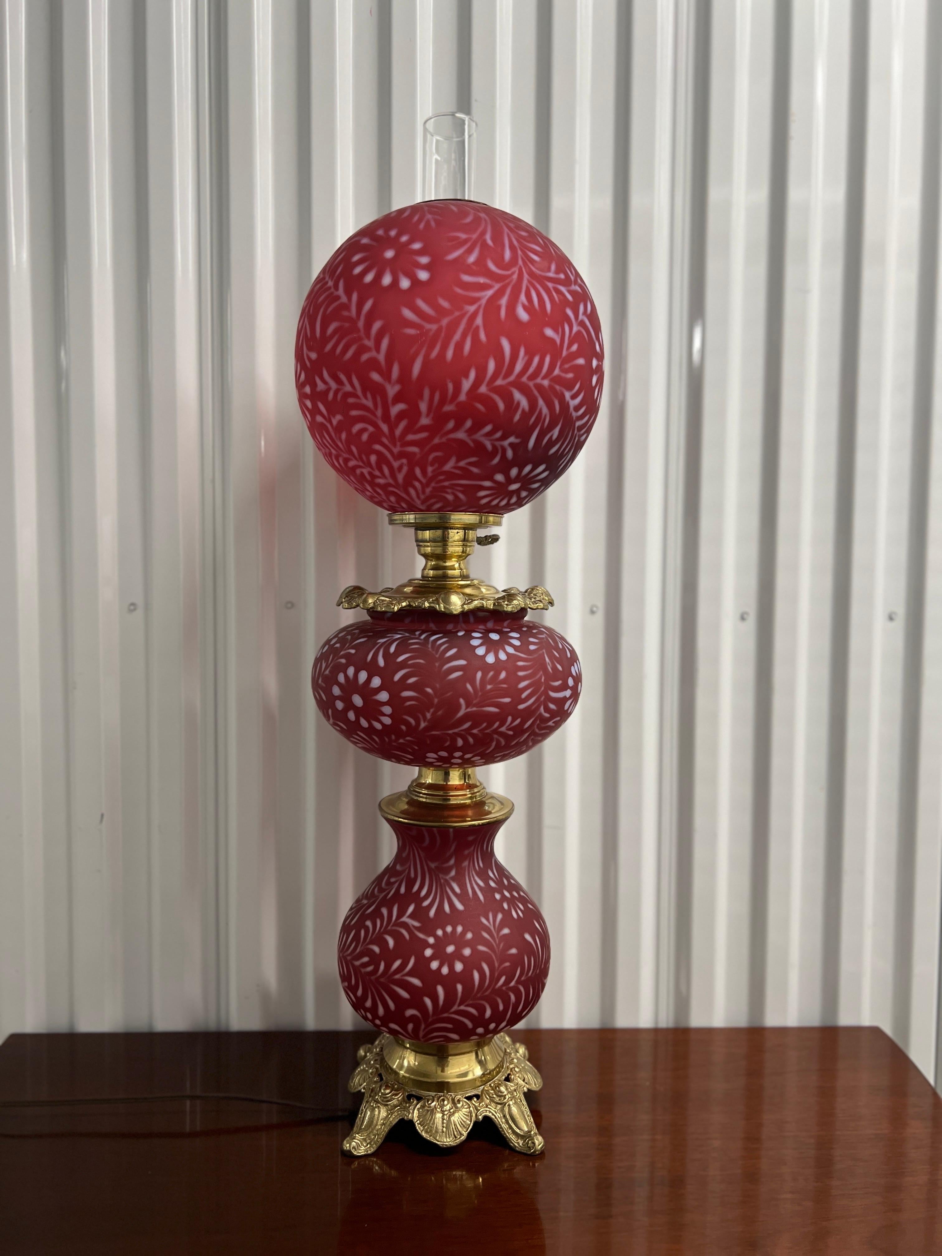 Fenton for LG Wright (American, circa 1970).

Stunning Fenton for LG Wright Daisy and Fern Cranberry Opalescent 3- Tier GWTW lamp!
This is the large version of the three tier lamp, not the shorter one that is typically seen around 
This lamp