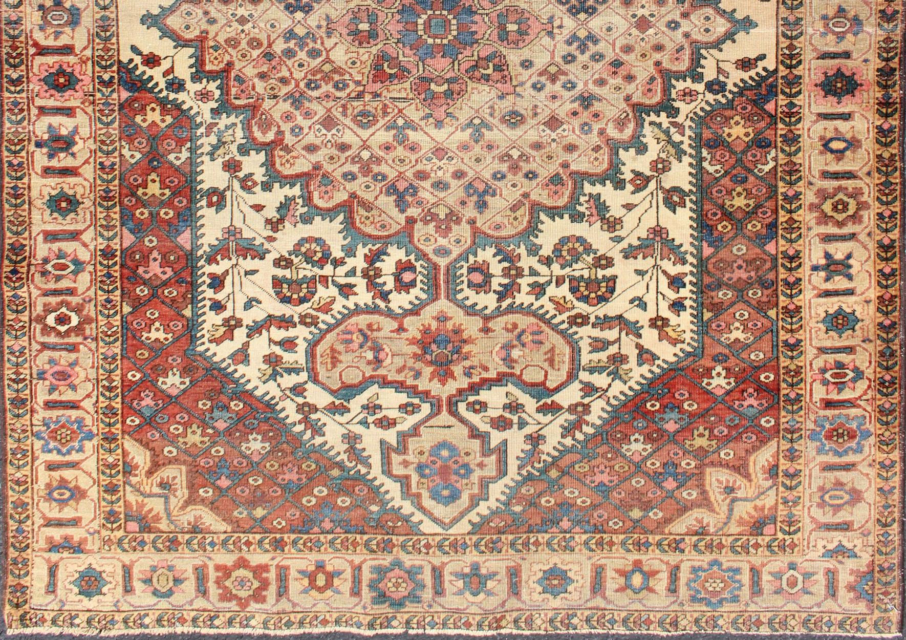 Antique Ferahan Sarouk rug in ivory background, red brown, camel and teal, green and denim blue. Rug/S12-0616. Antique Sarouk Faraghan
This outstanding antique Farahan Sarouk carpet is primarily characterized by its classical composition and as a