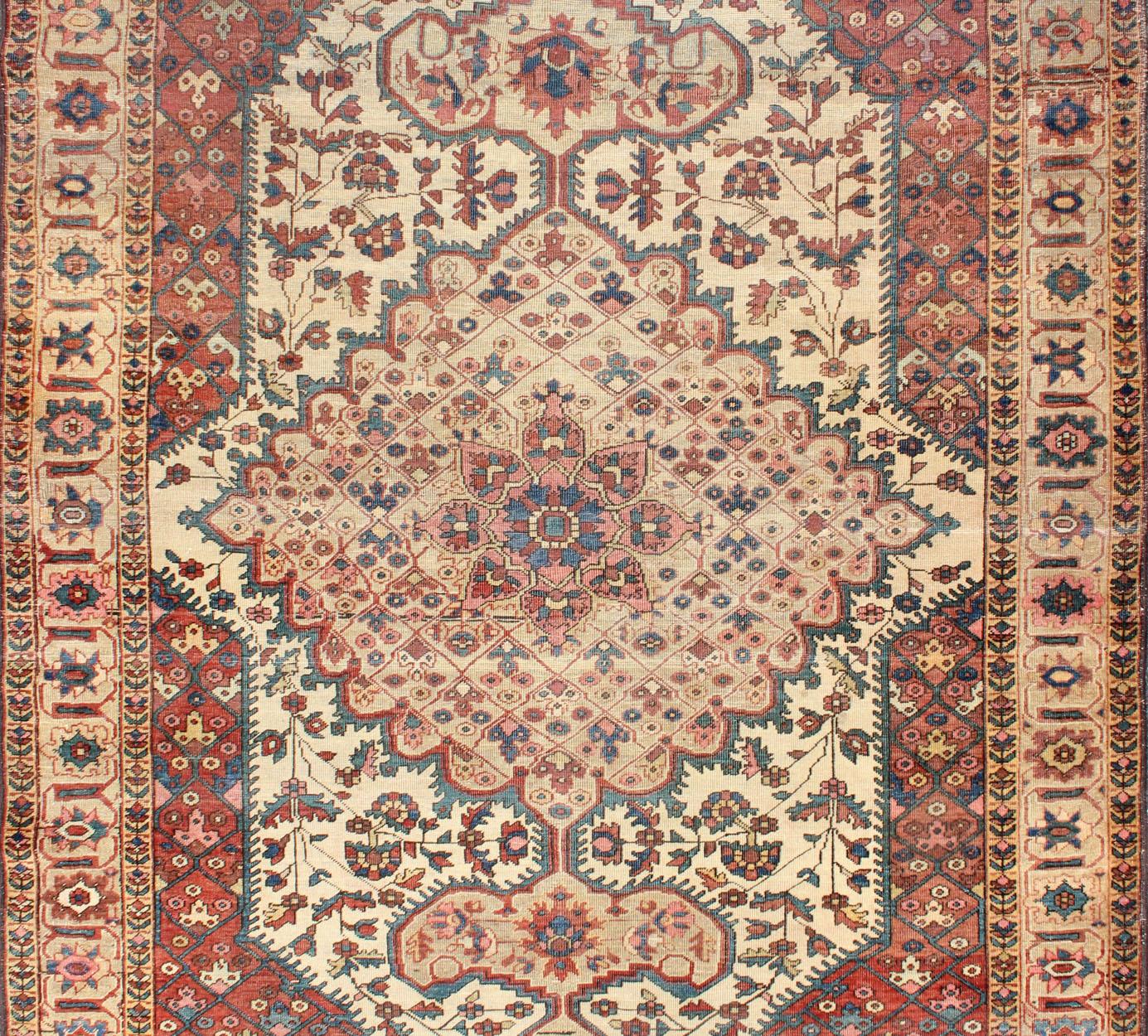 Sarouk Farahan Antique Feraghan Sarouk Rug in Ivory Background, Brown Red, Camel, and Teal For Sale