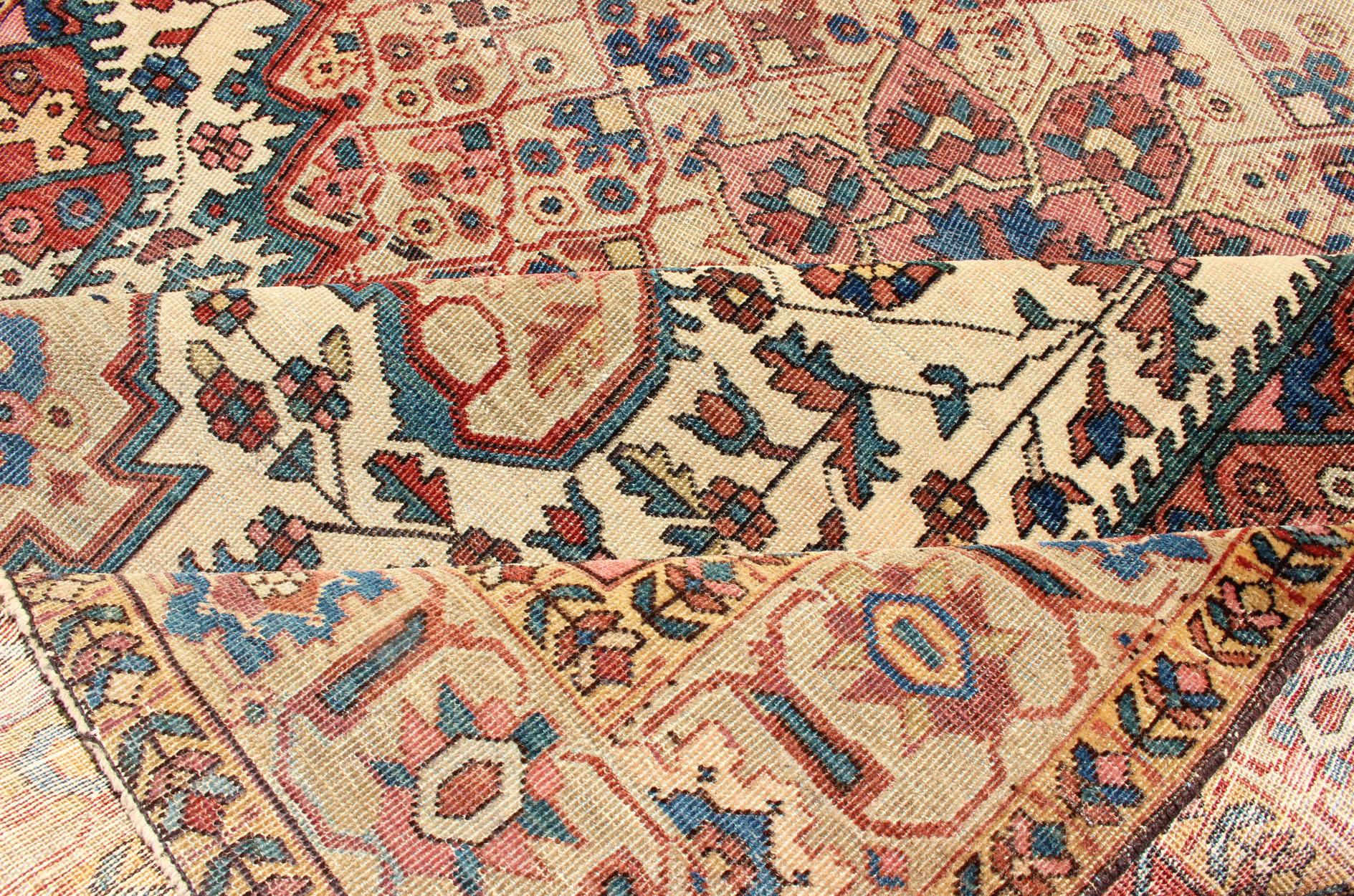 Antique Feraghan Sarouk Rug in Ivory Background, Brown Red, Camel, and Teal In Good Condition For Sale In Atlanta, GA