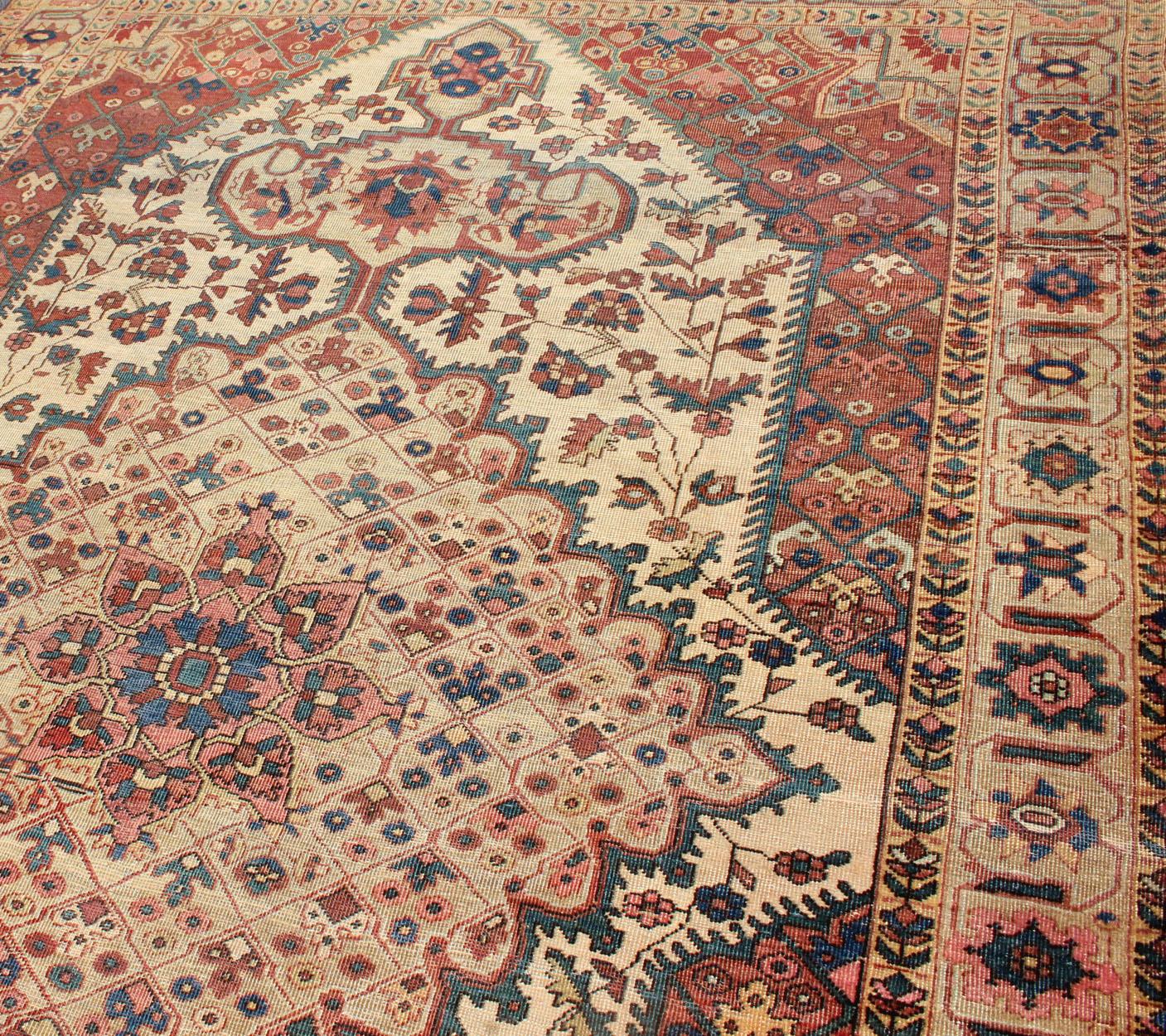 19th Century Antique Feraghan Sarouk Rug in Ivory Background, Brown Red, Camel, and Teal For Sale