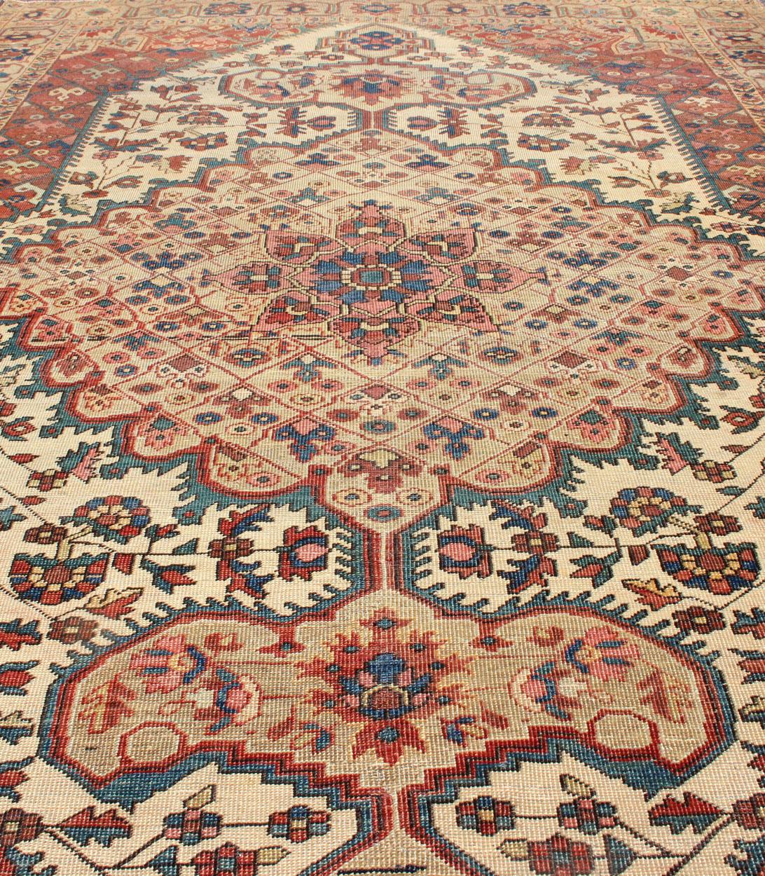19th Century Antique Feraghan Sarouk Rug in Ivory Background, Brown Red, Camel, and Teal For Sale
