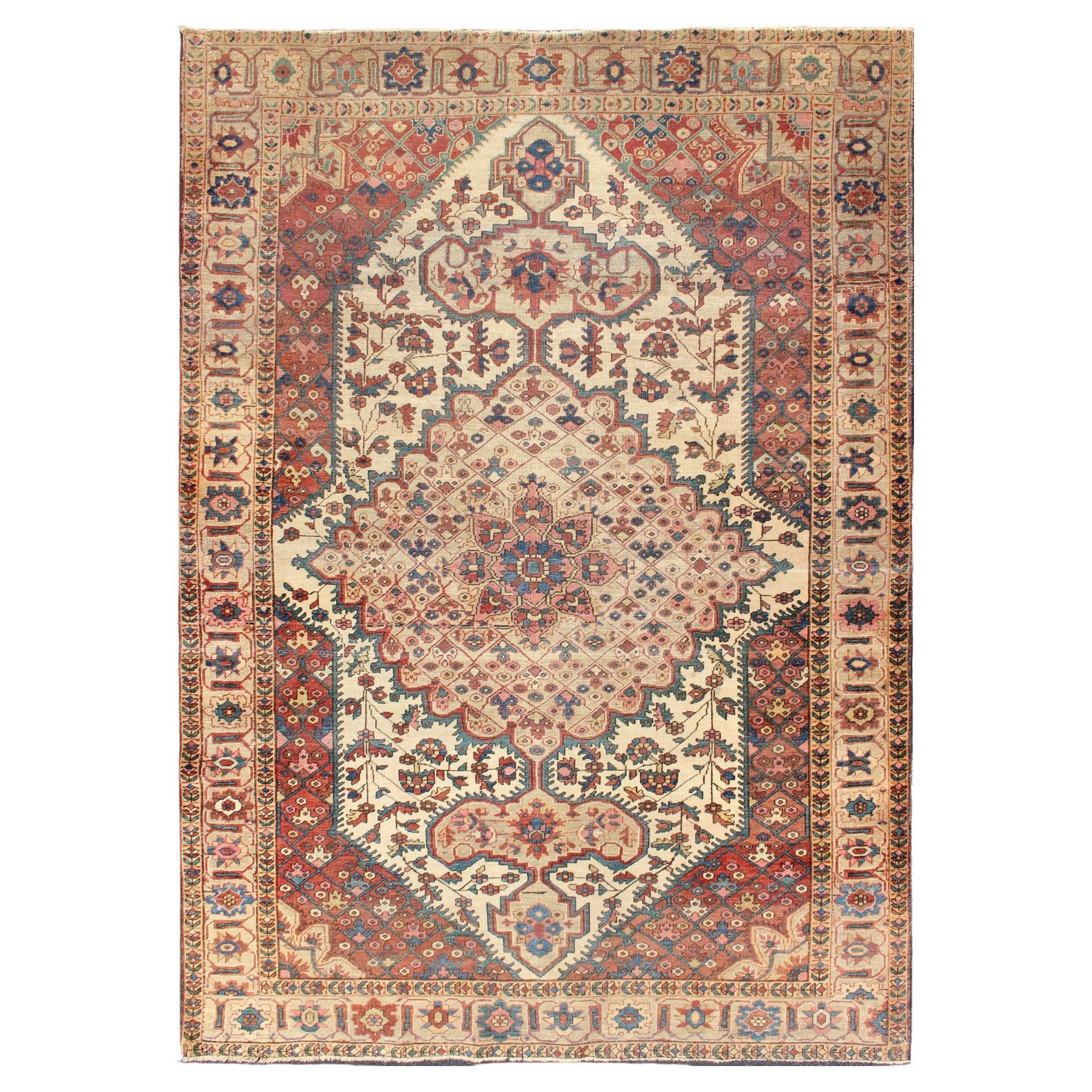Antique Feraghan Sarouk Rug in Ivory Background, Brown Red, Camel, and Teal For Sale