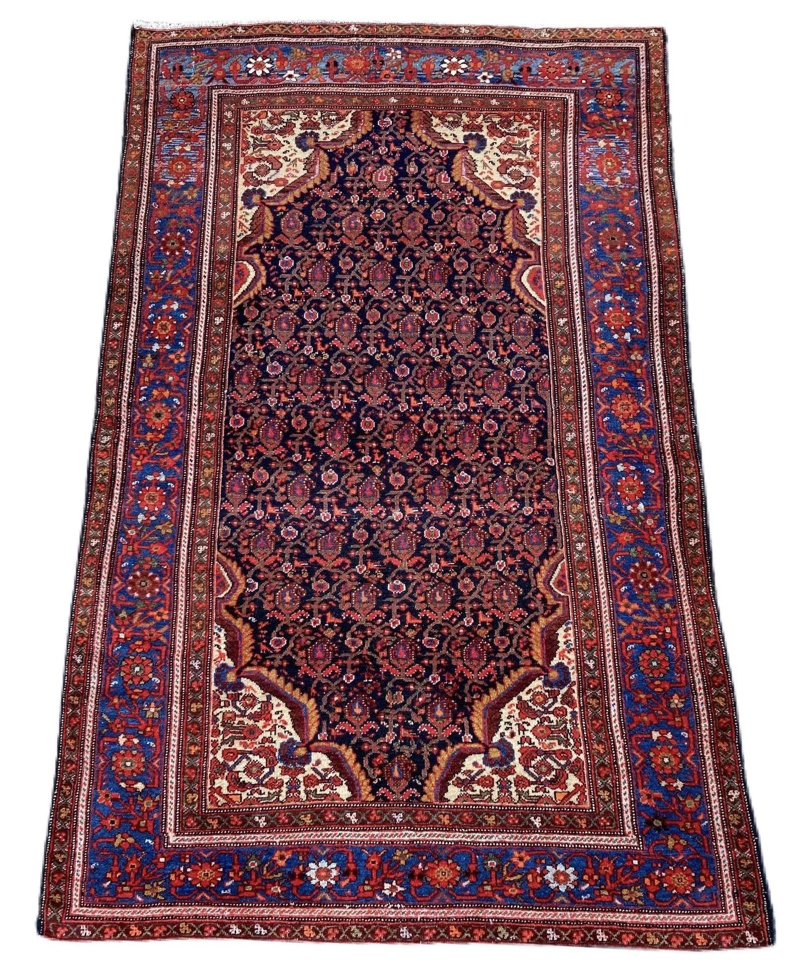 A beautiful antique Ferahan rug, handwoven circa 1900 with an allover Herati design on a midnight blue field and lighter indigo border. Finely woven with lovely wool quality and great secondary colours, especially the soft gold in the corner