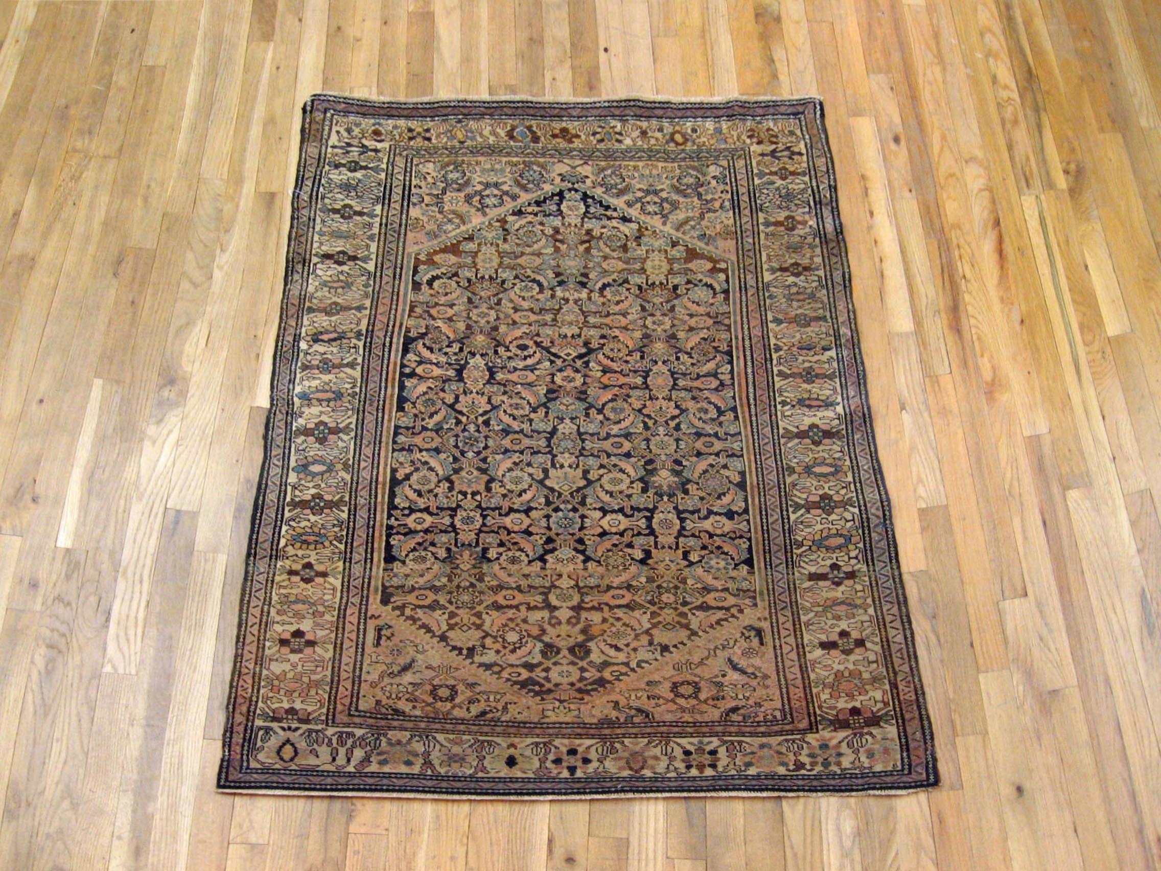 Antique Ferahan Sarouk Oriental rug, circa 1900, small size.

An antique Ferahan Sarouk oriental rug, size 4'9
