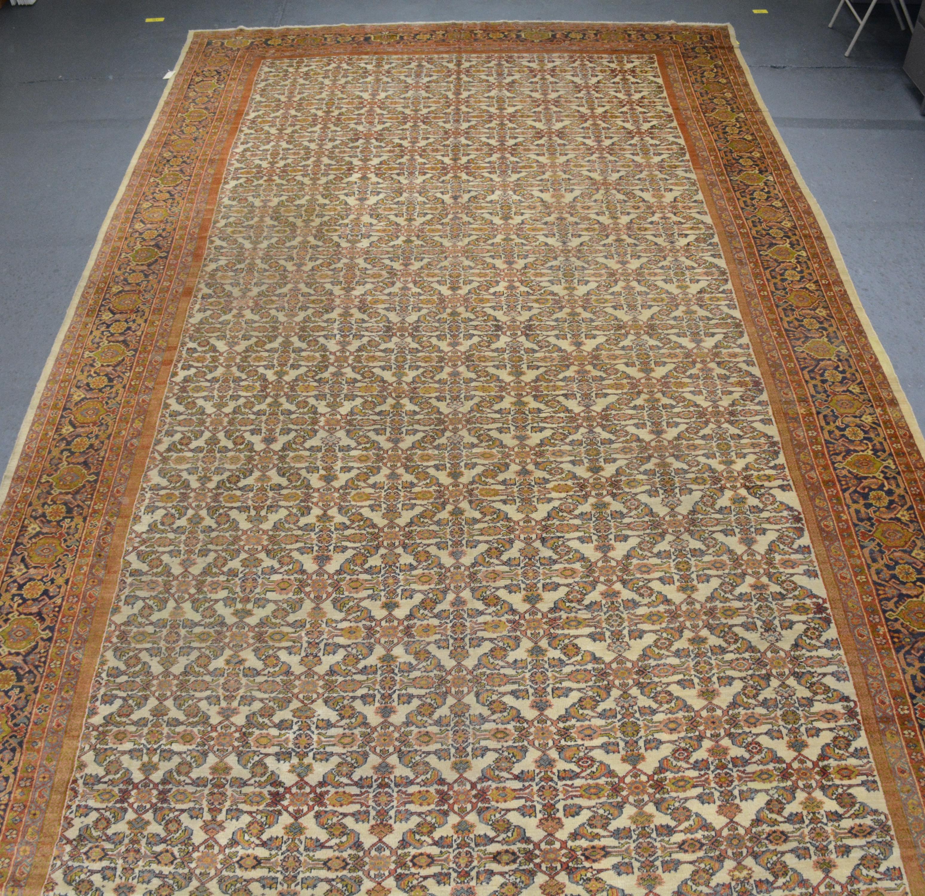 An antique Fereghan carpet from northern Persia, late 19th century, measuring 20' 0