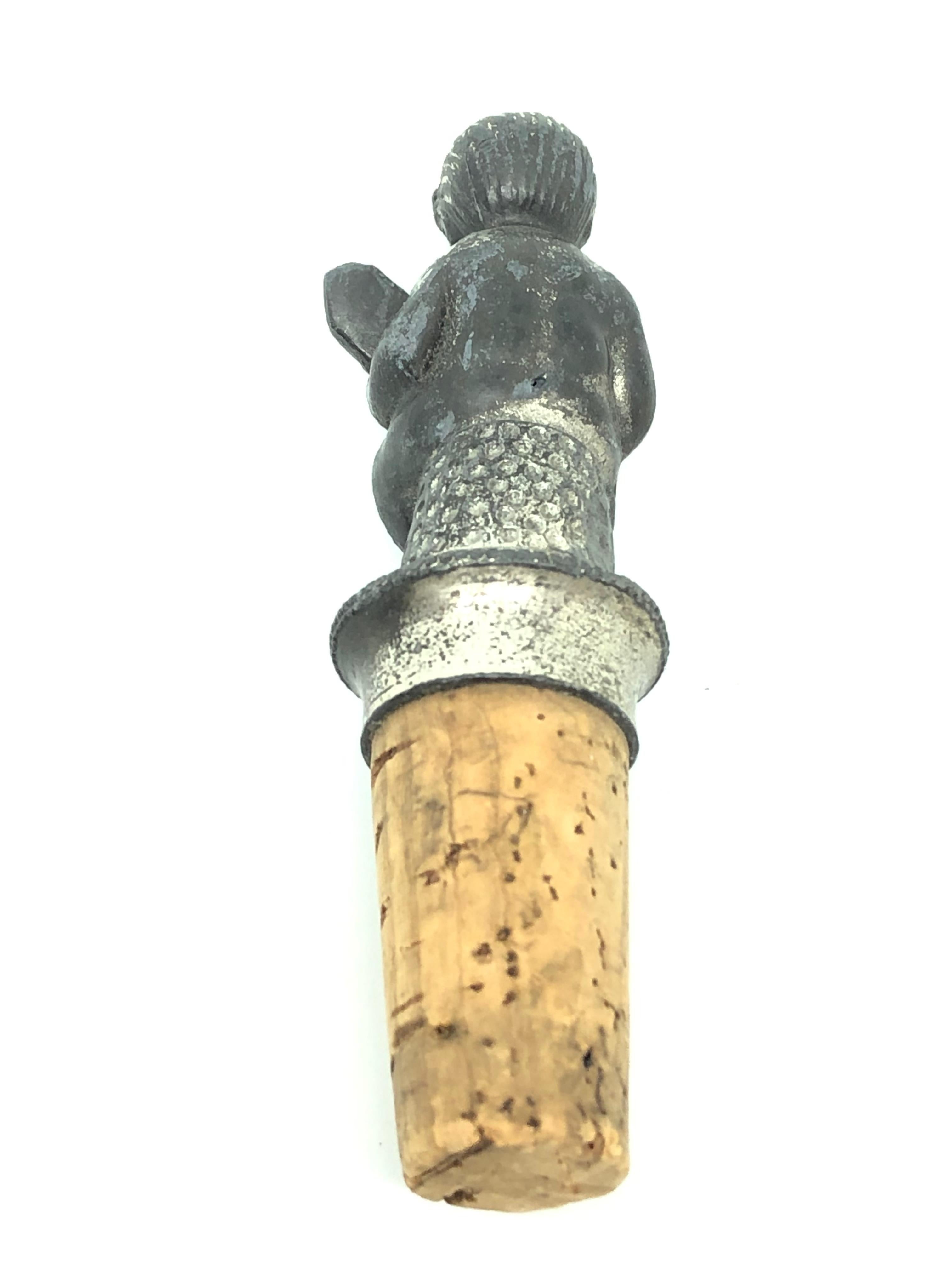 A beautiful metal and cork bottle stopper. Some wear with a nice patina, but this is old-age. Made of metal and cork. A beautiful nice Barware item or just a display item in your collections of antique bottle stoppers.

 